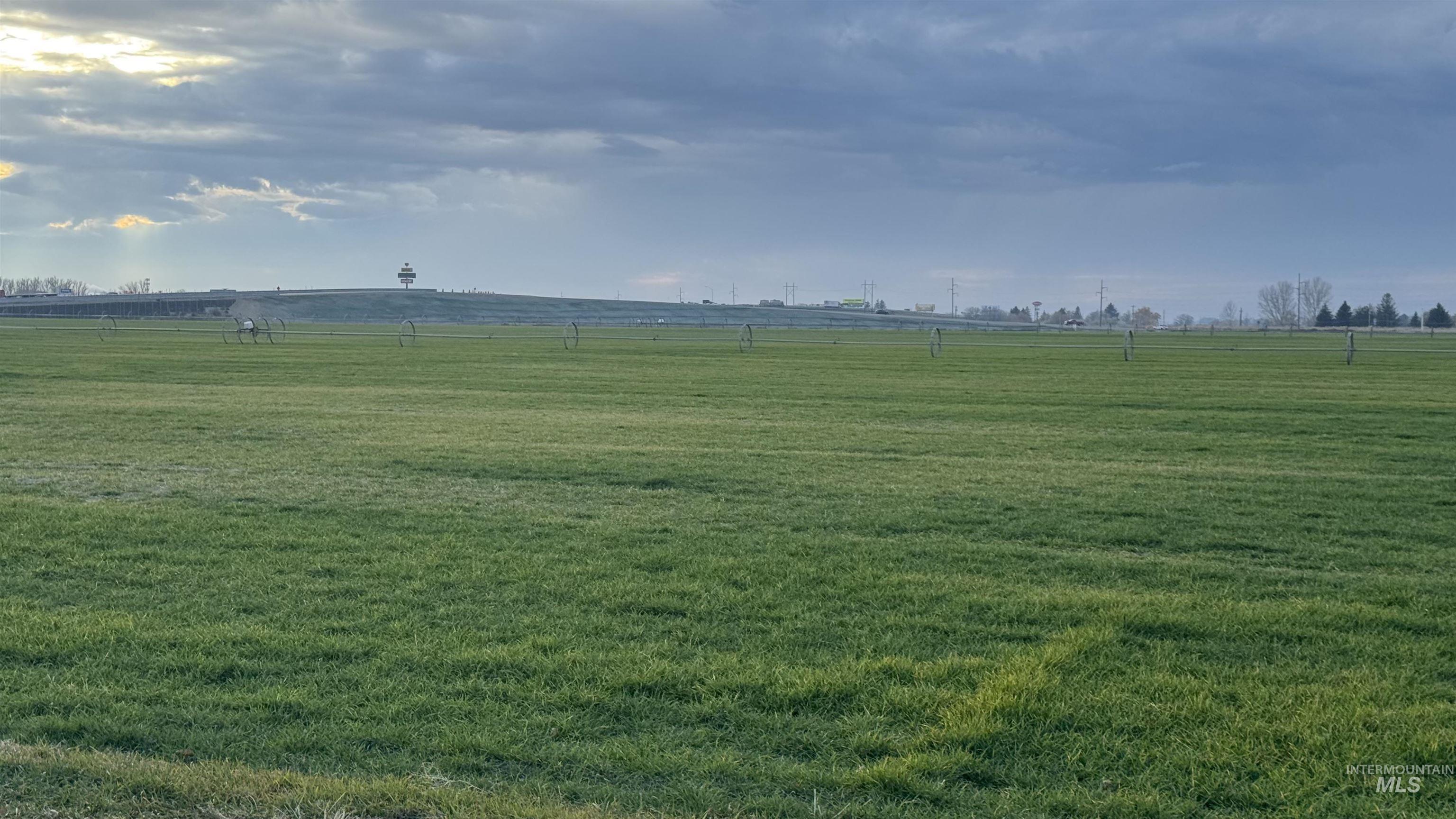 View of green lawn with a view of countryside