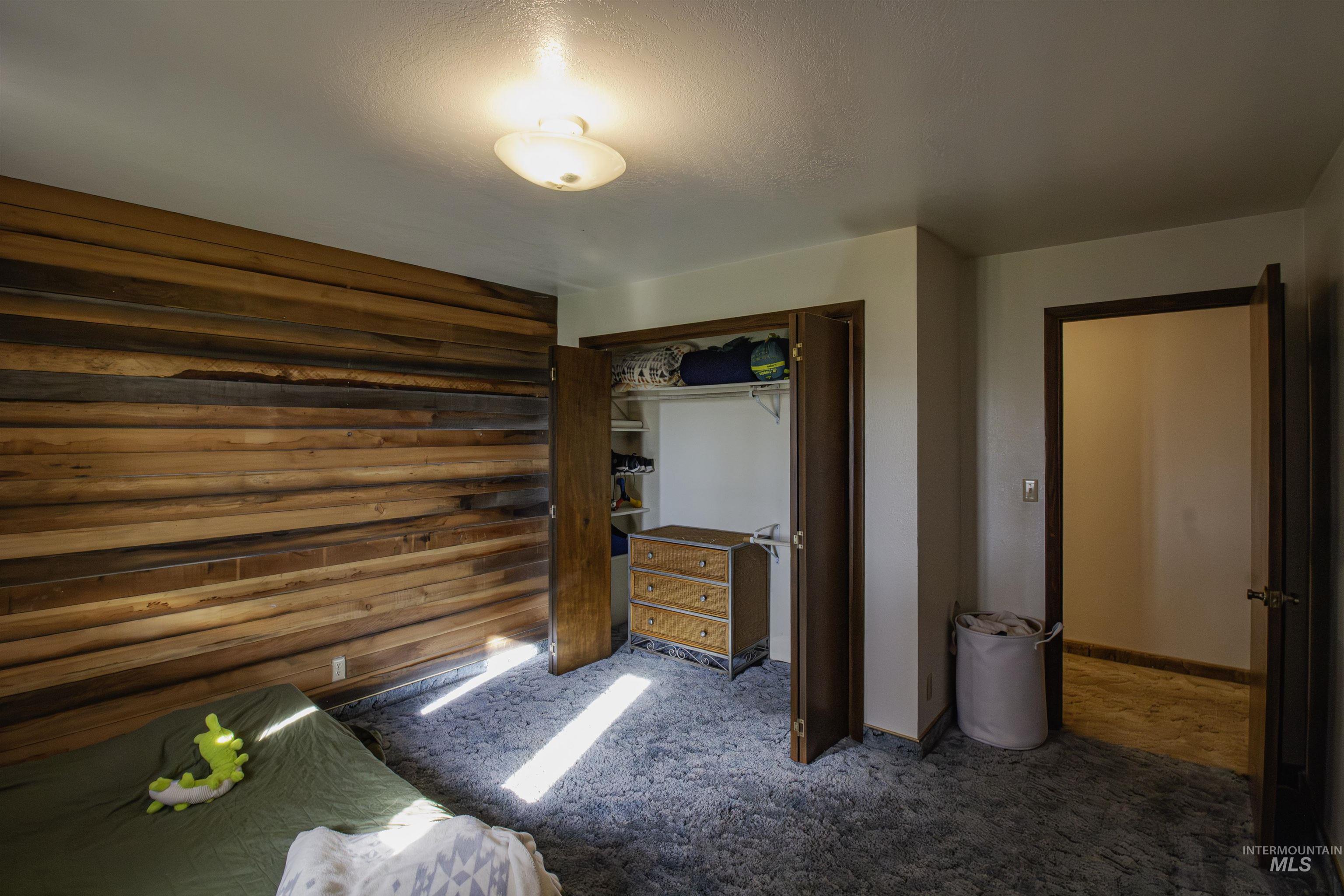 Bedroom featuring a closet and carpet flooring