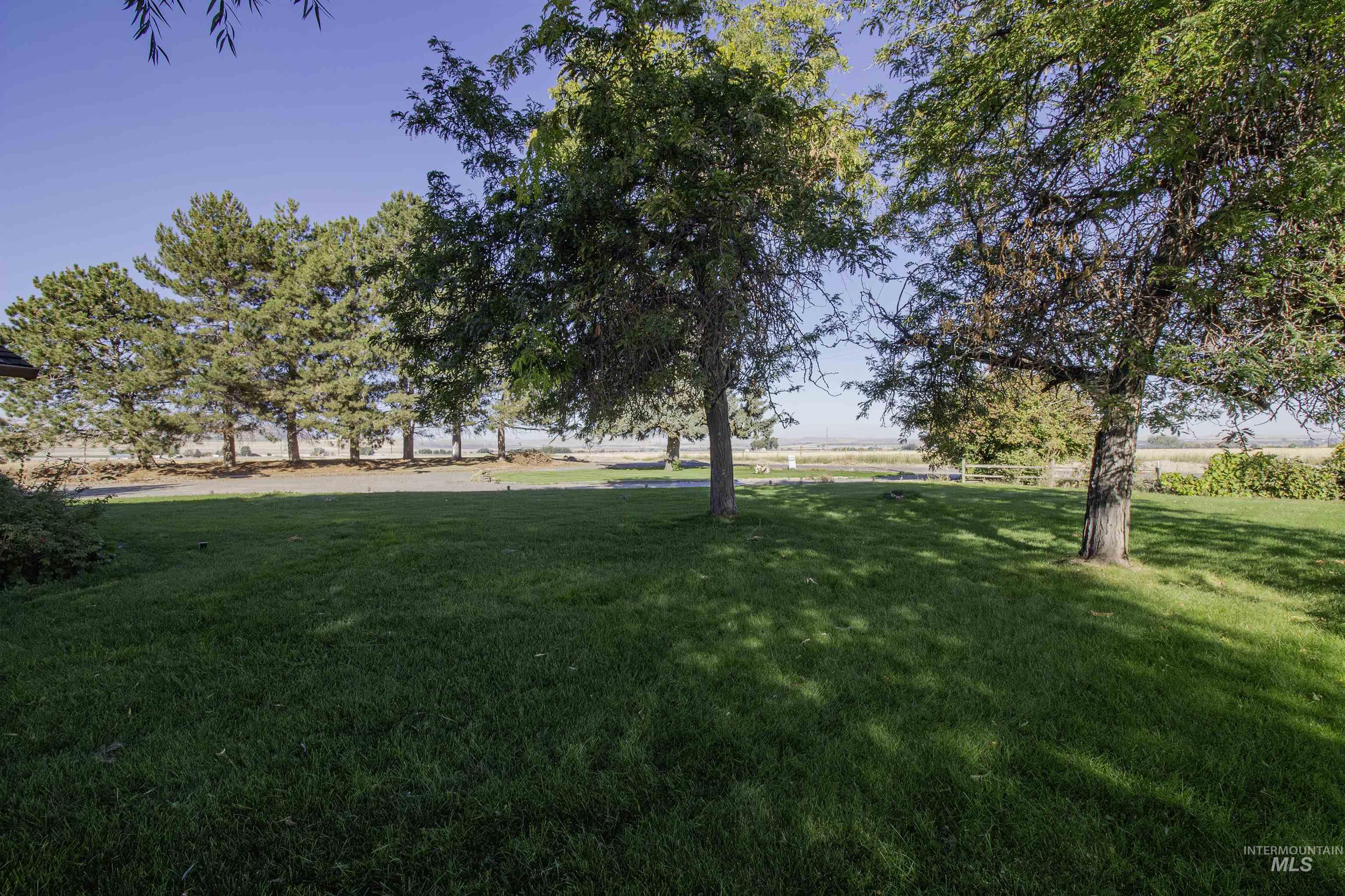 View of green lawn featuring a rural view