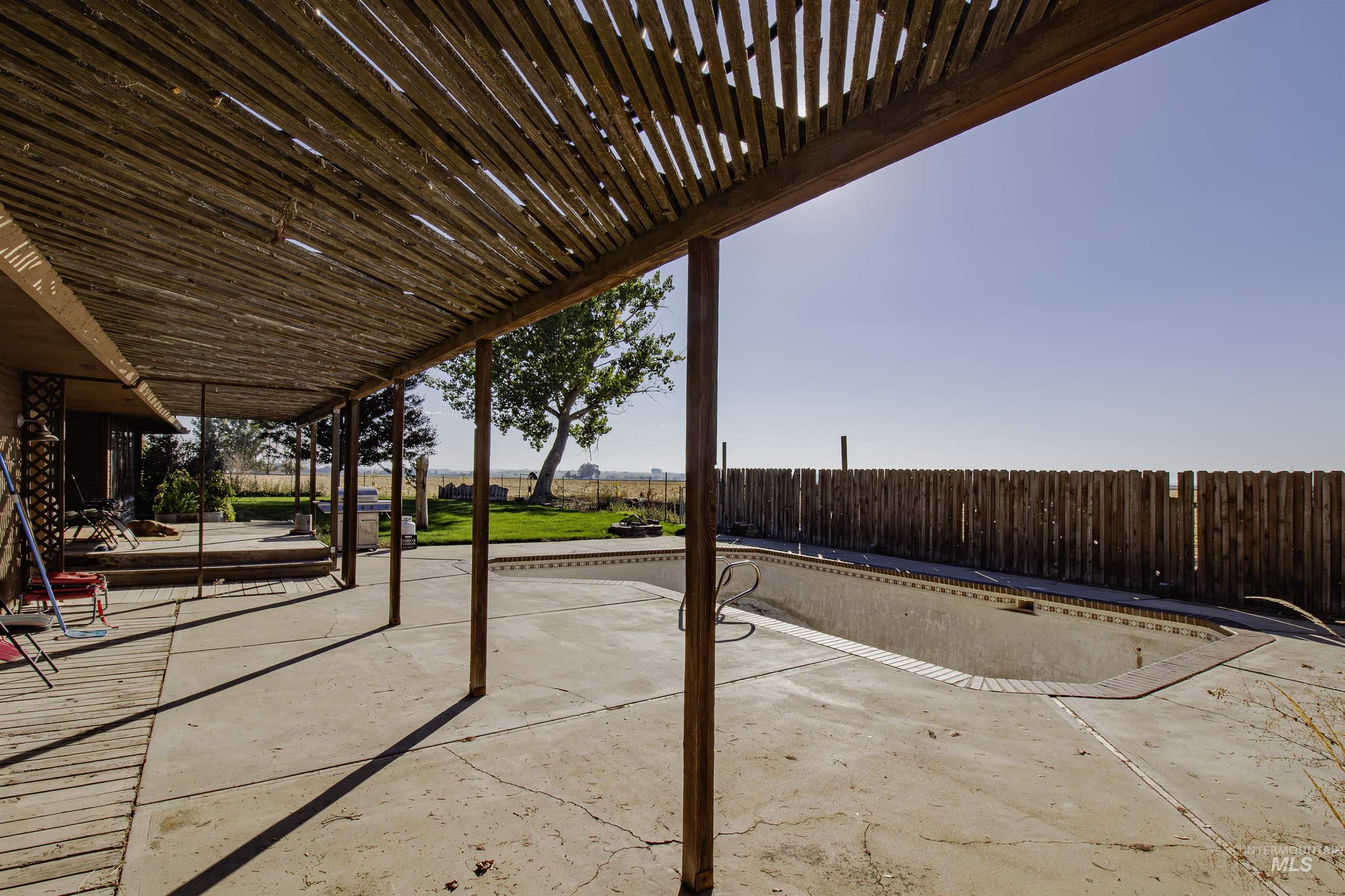 Fenced backyard with a patio area