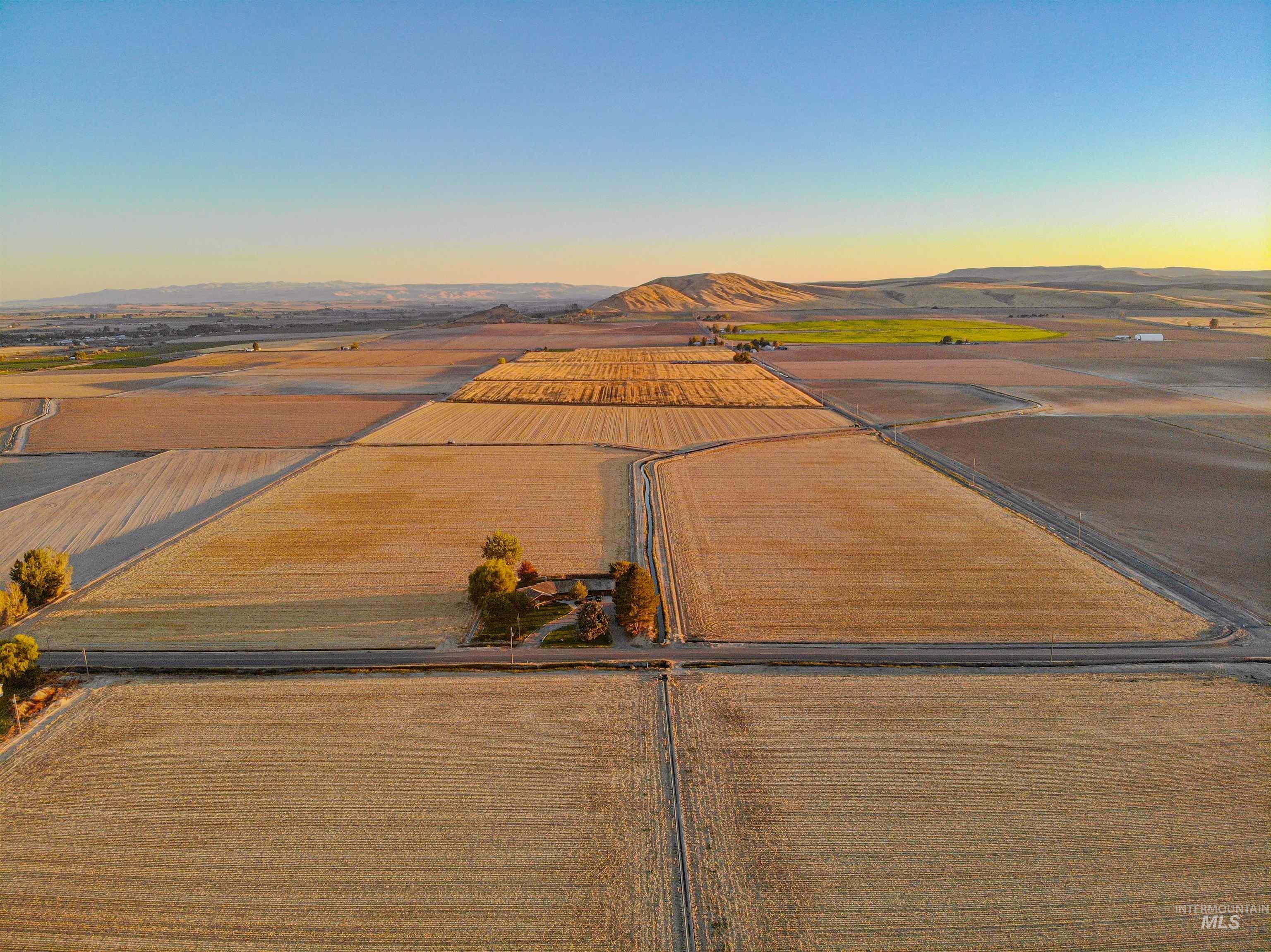 Aerial view of sparsely populated area with extensive farmland