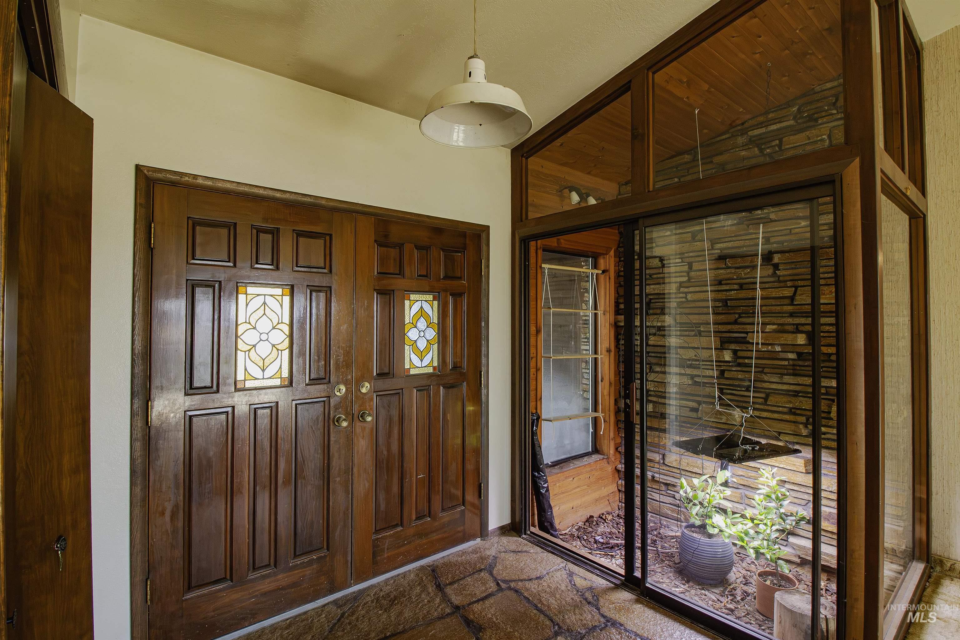 Entryway featuring stone finish floors
