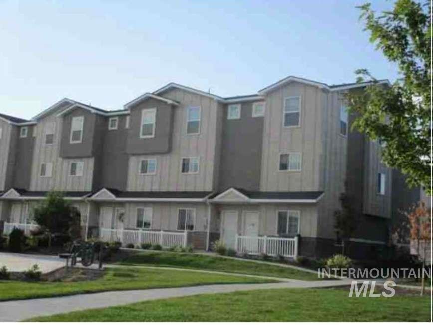 View of front of property with a front lawn and a residential view