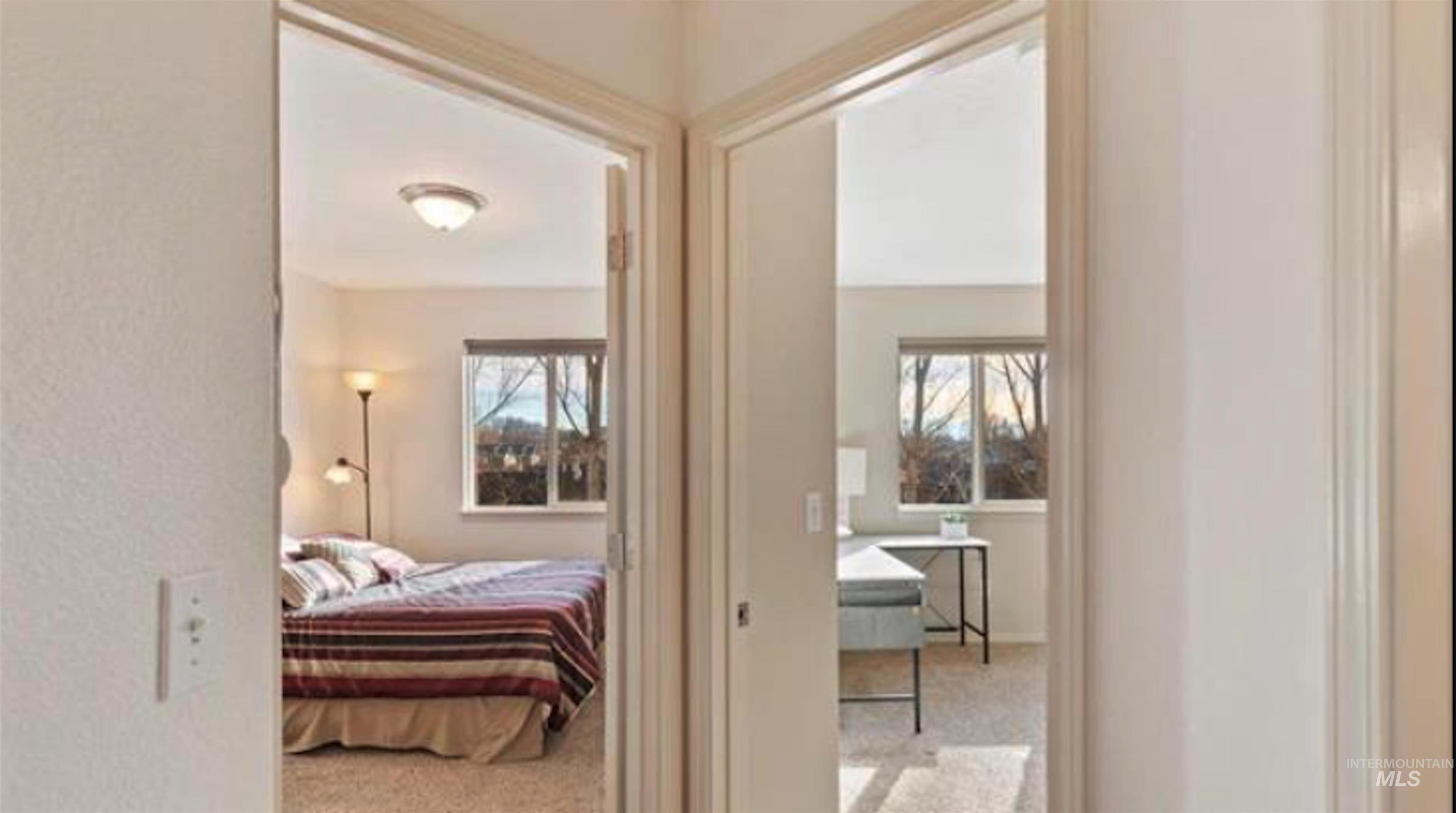 Hall with light colored carpet