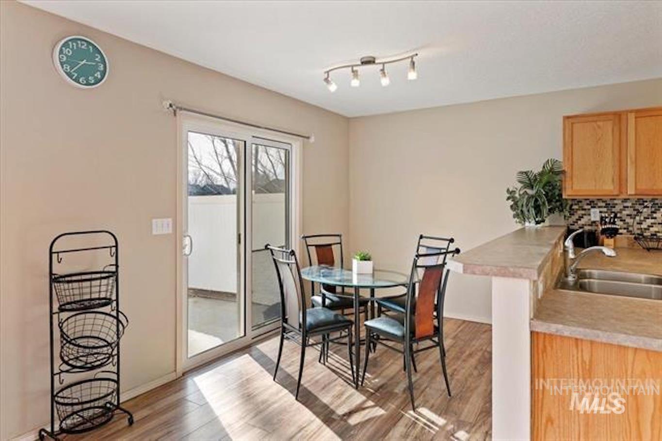 Dining space featuring light wood-style floors and baseboards
