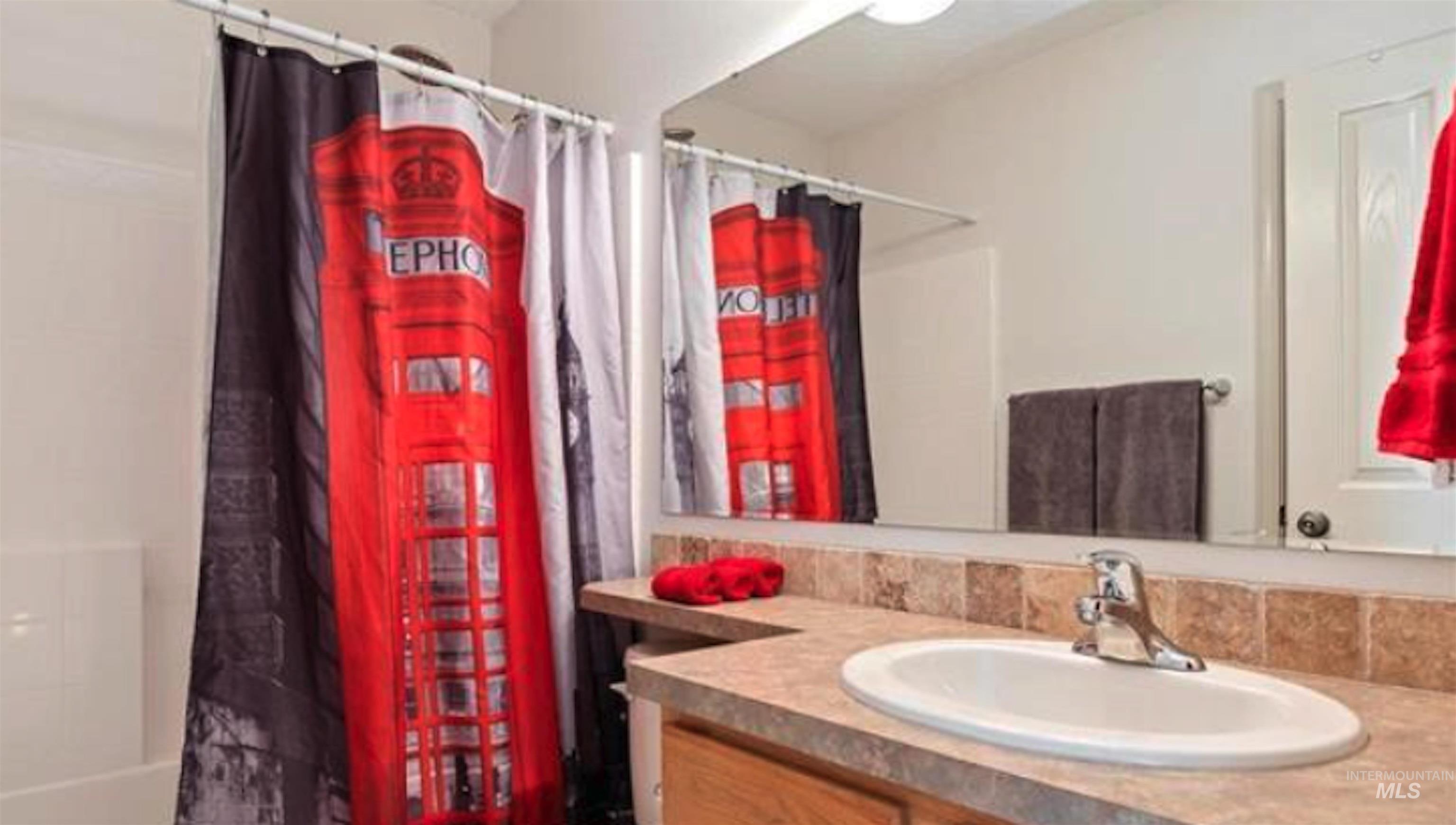 Bathroom featuring vanity and a shower with curtain
