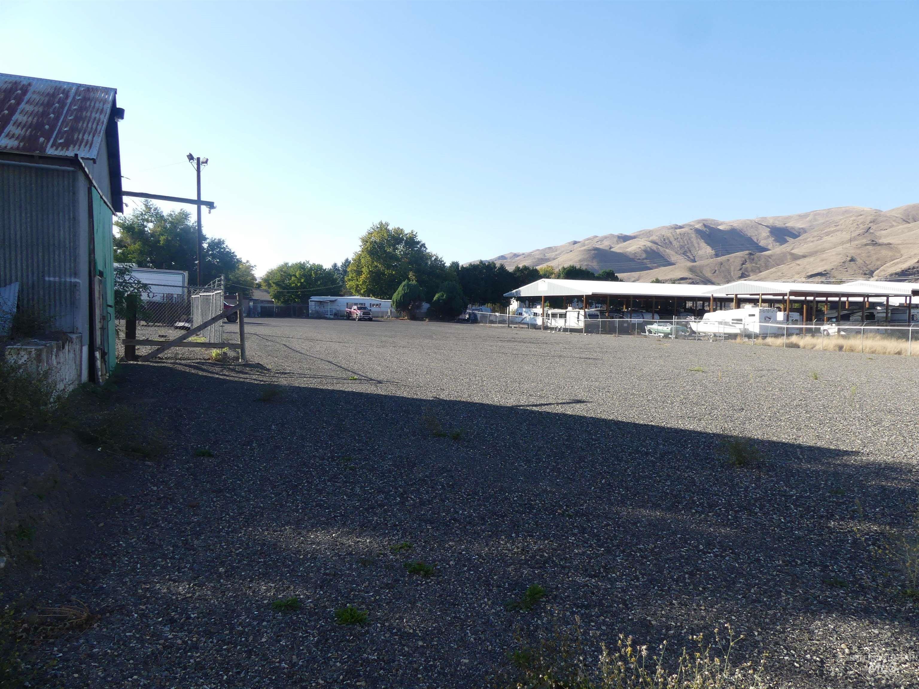 View of dirt / gravel road featuring a mountain view
