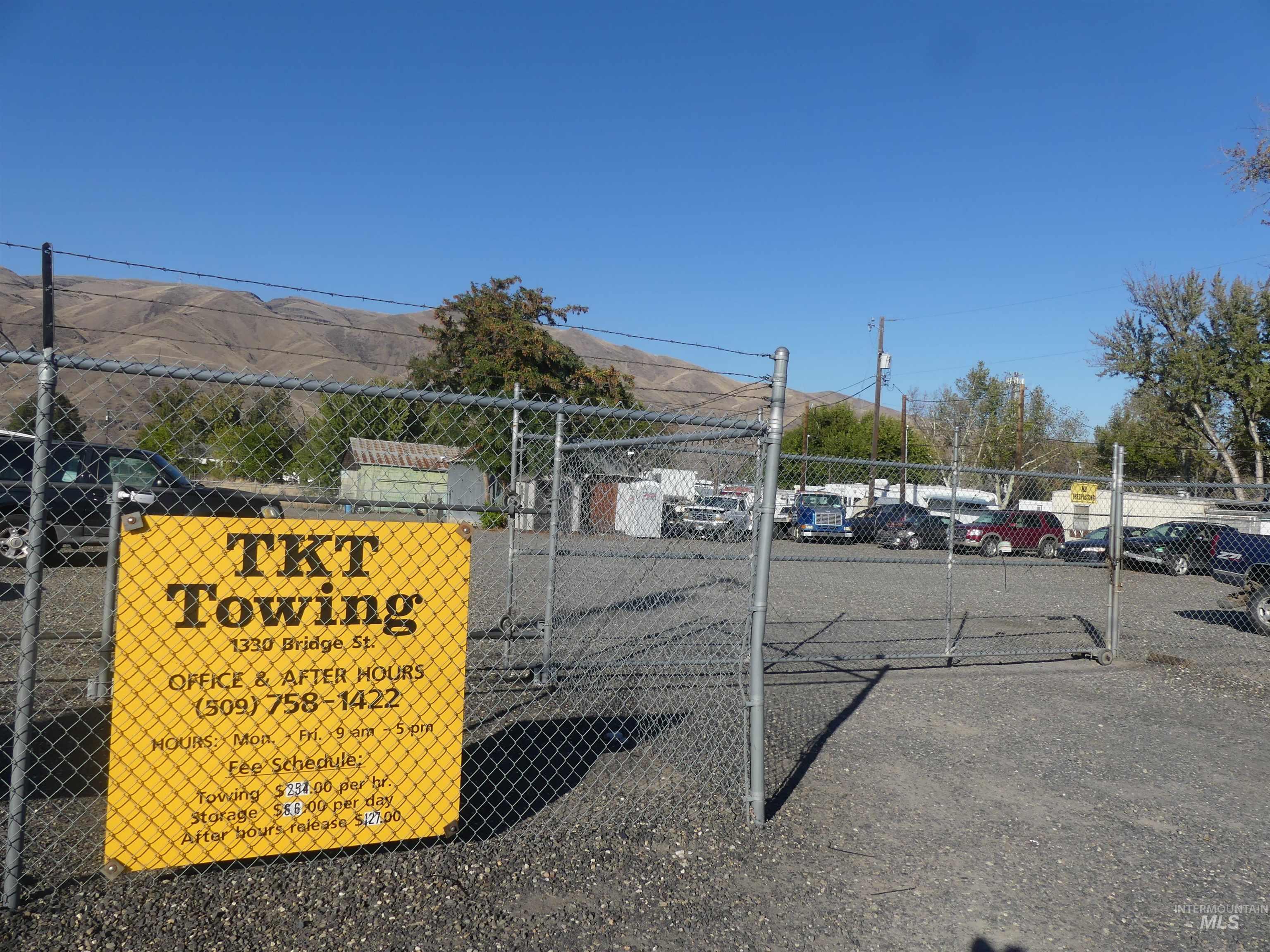 Uncovered parking lot featuring a mountain view