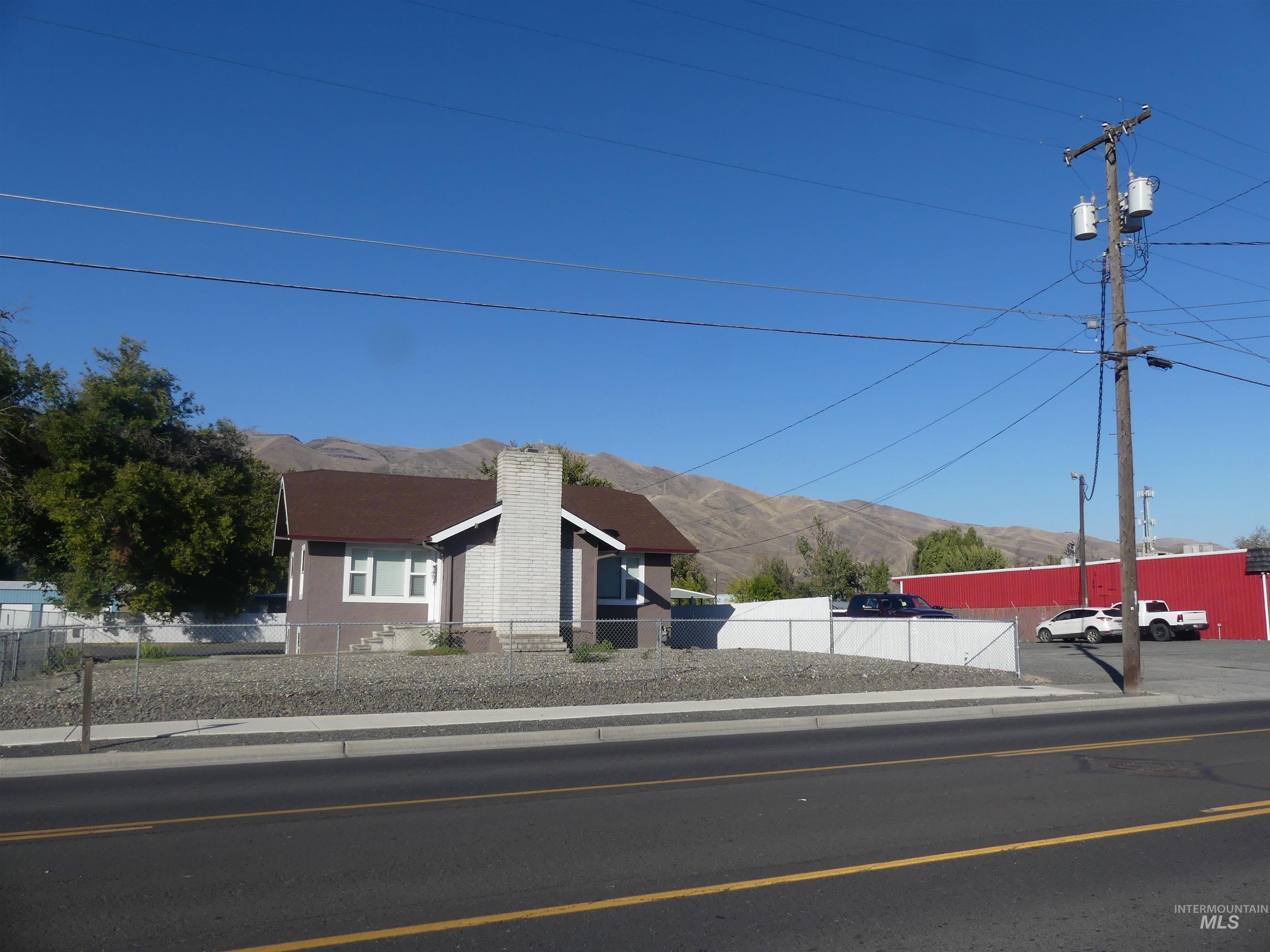 View of front of house featuring a mountain view and a chimney