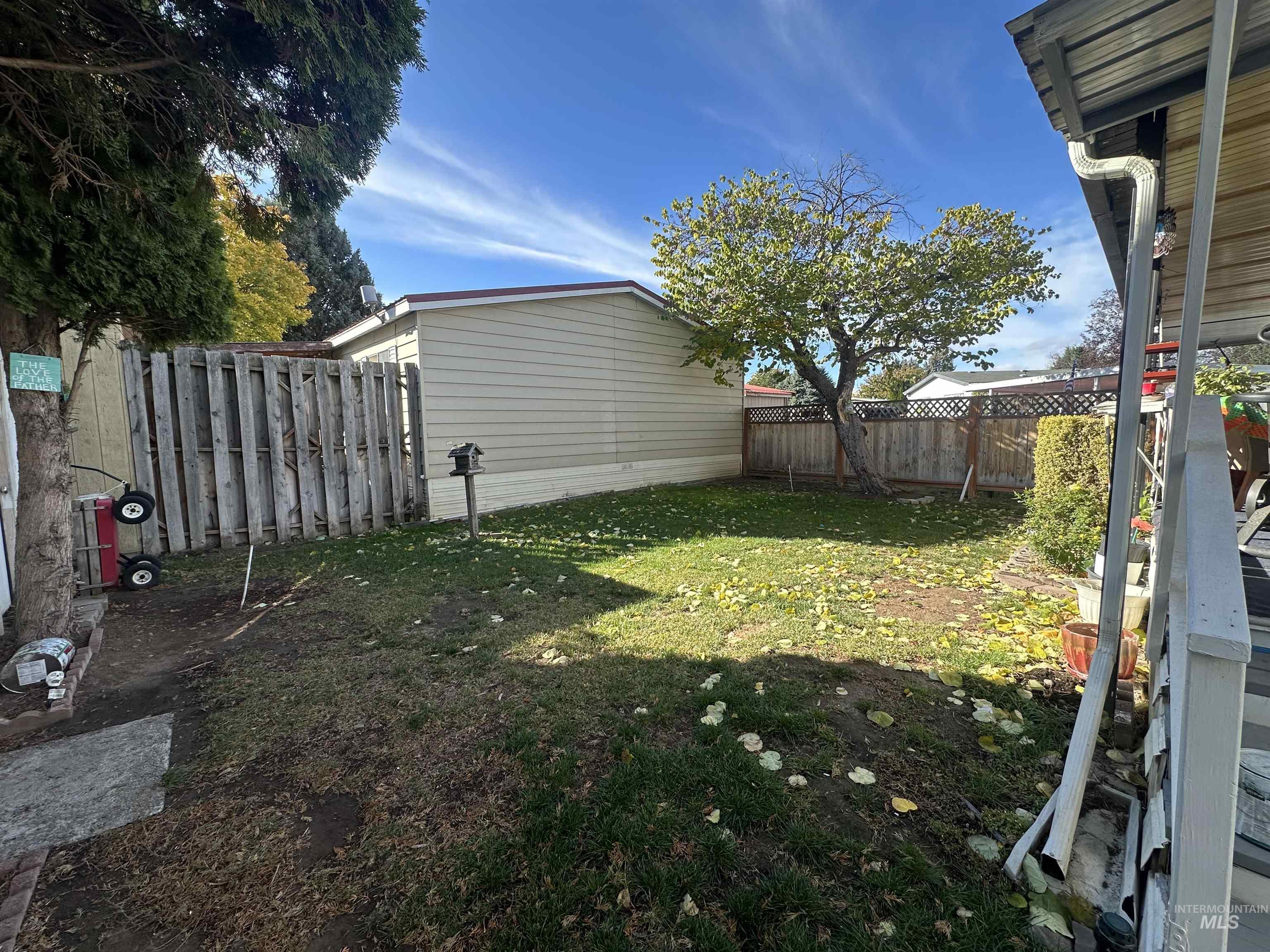 View of fenced backyard