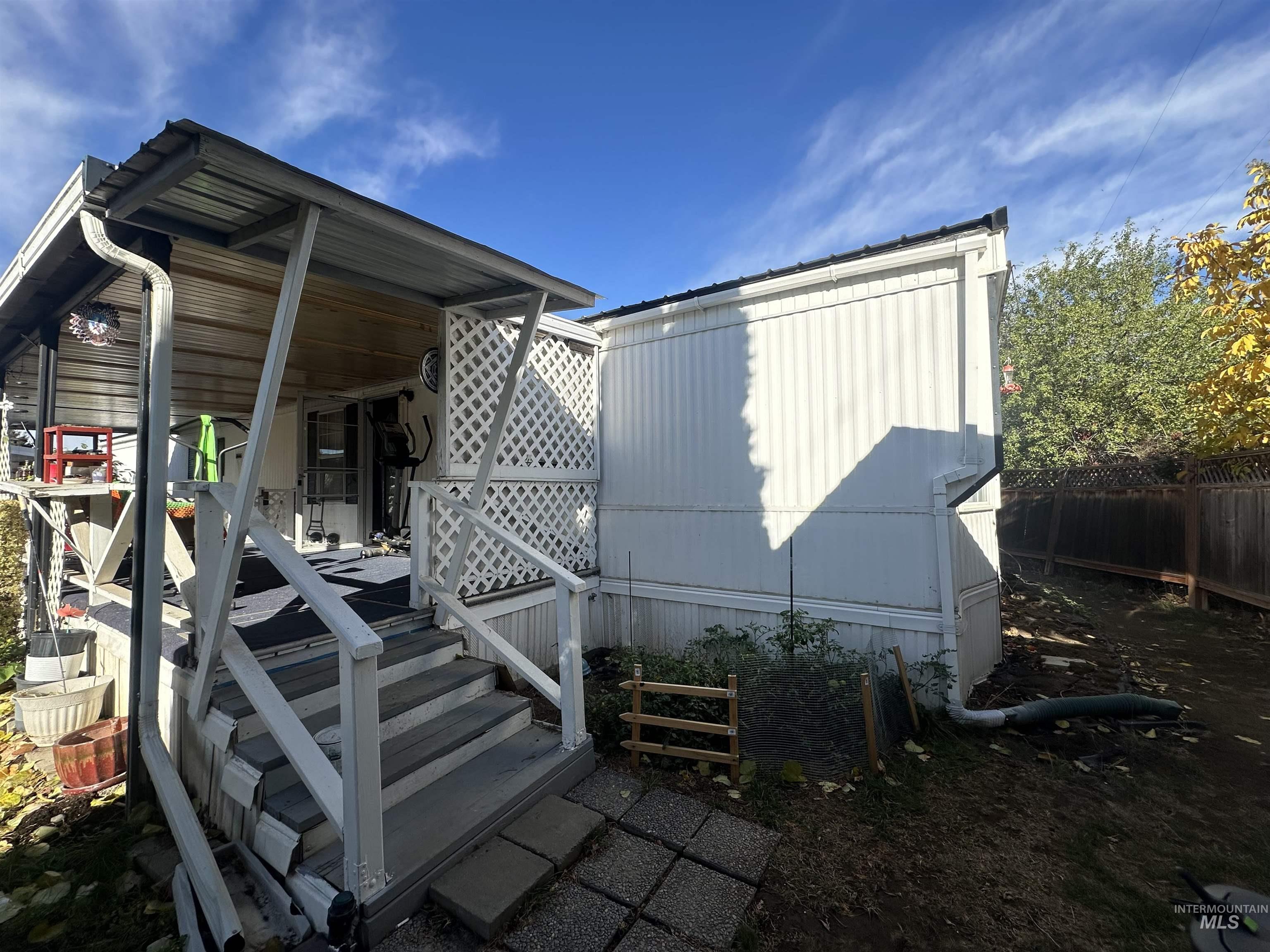 View of patio with a wooden deck
