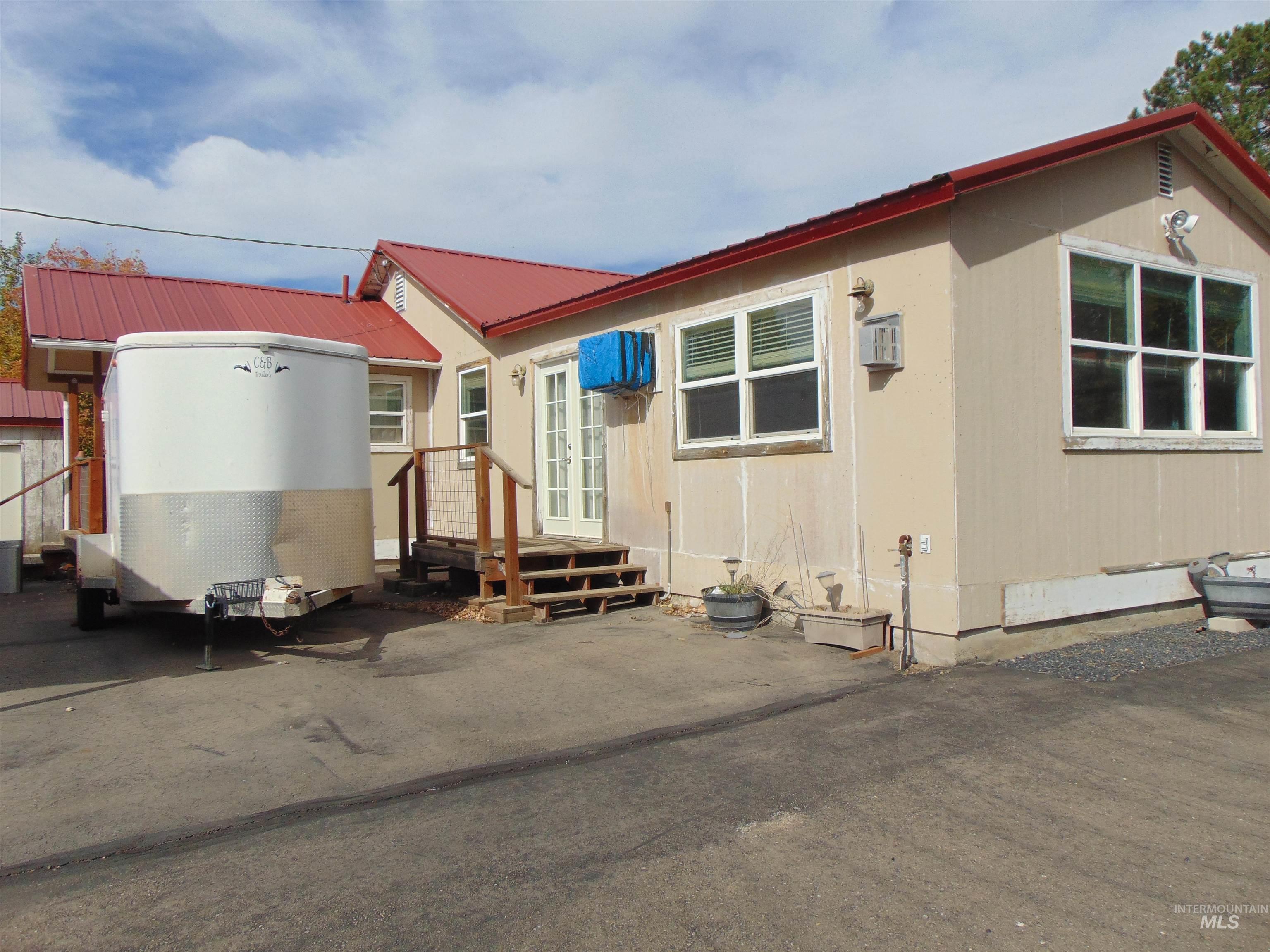 View of front of house with a metal roof