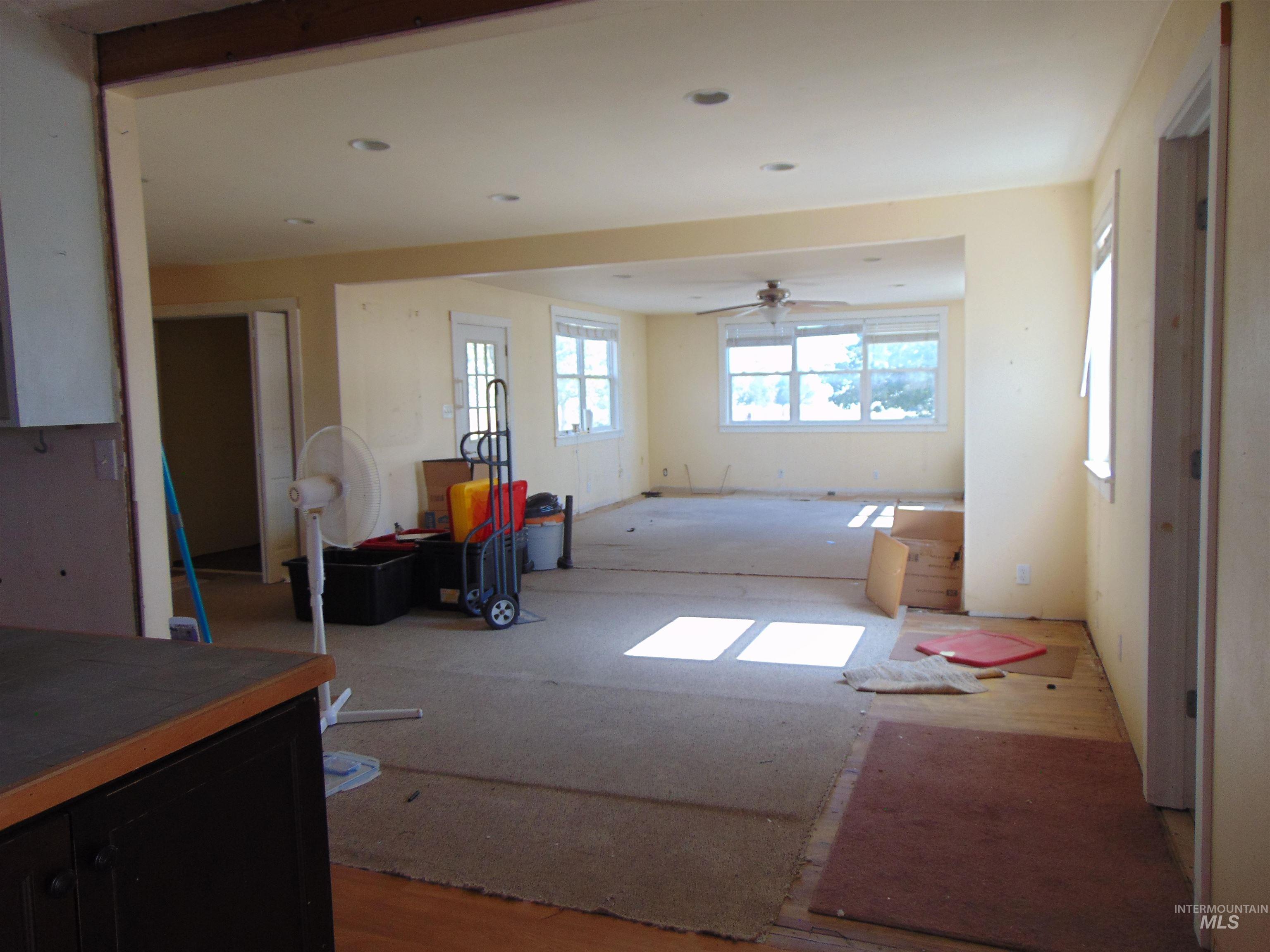 Empty room featuring a ceiling fan and wood finished floors