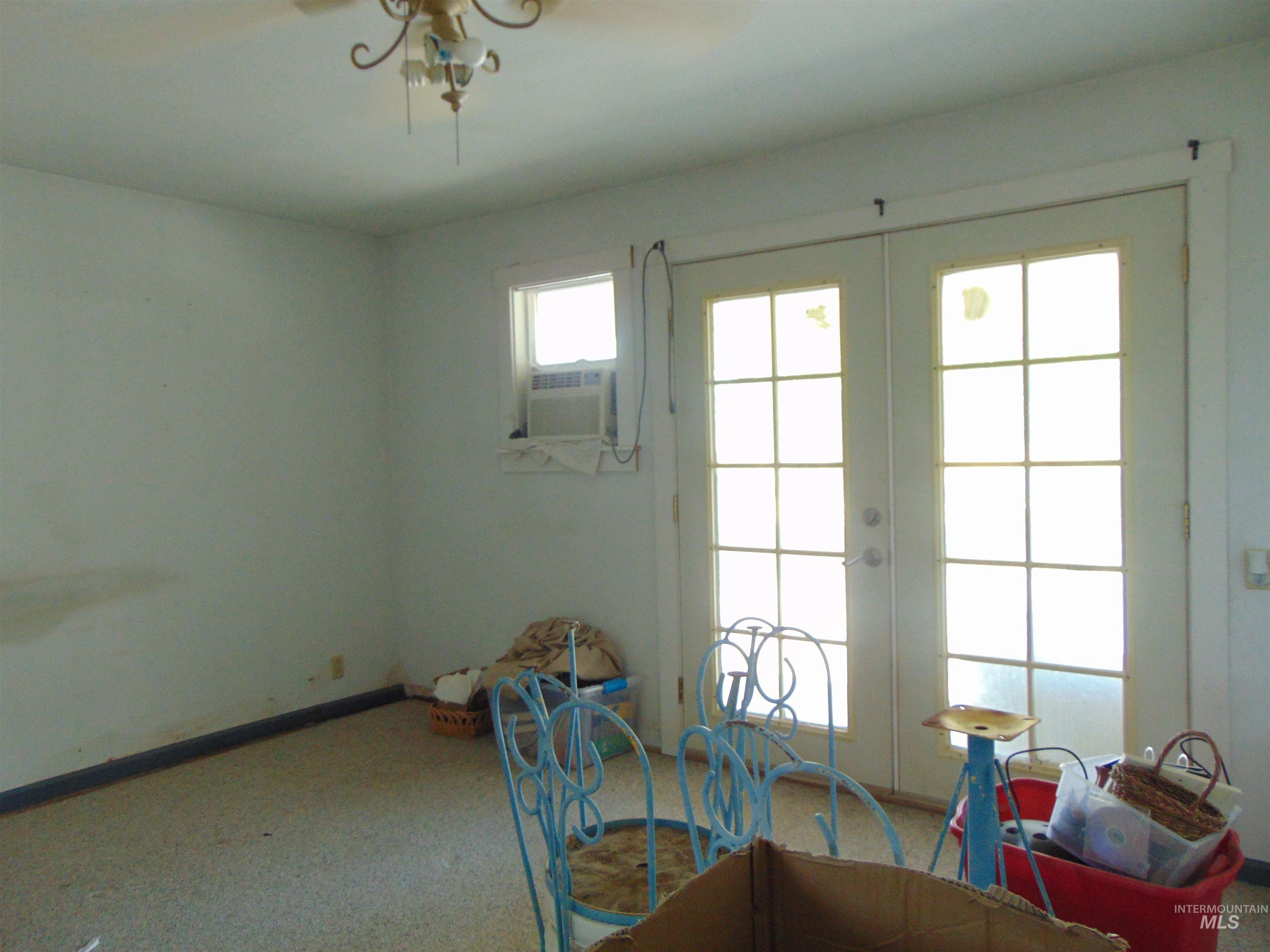 Dining room featuring french doors, carpet flooring, and cooling unit