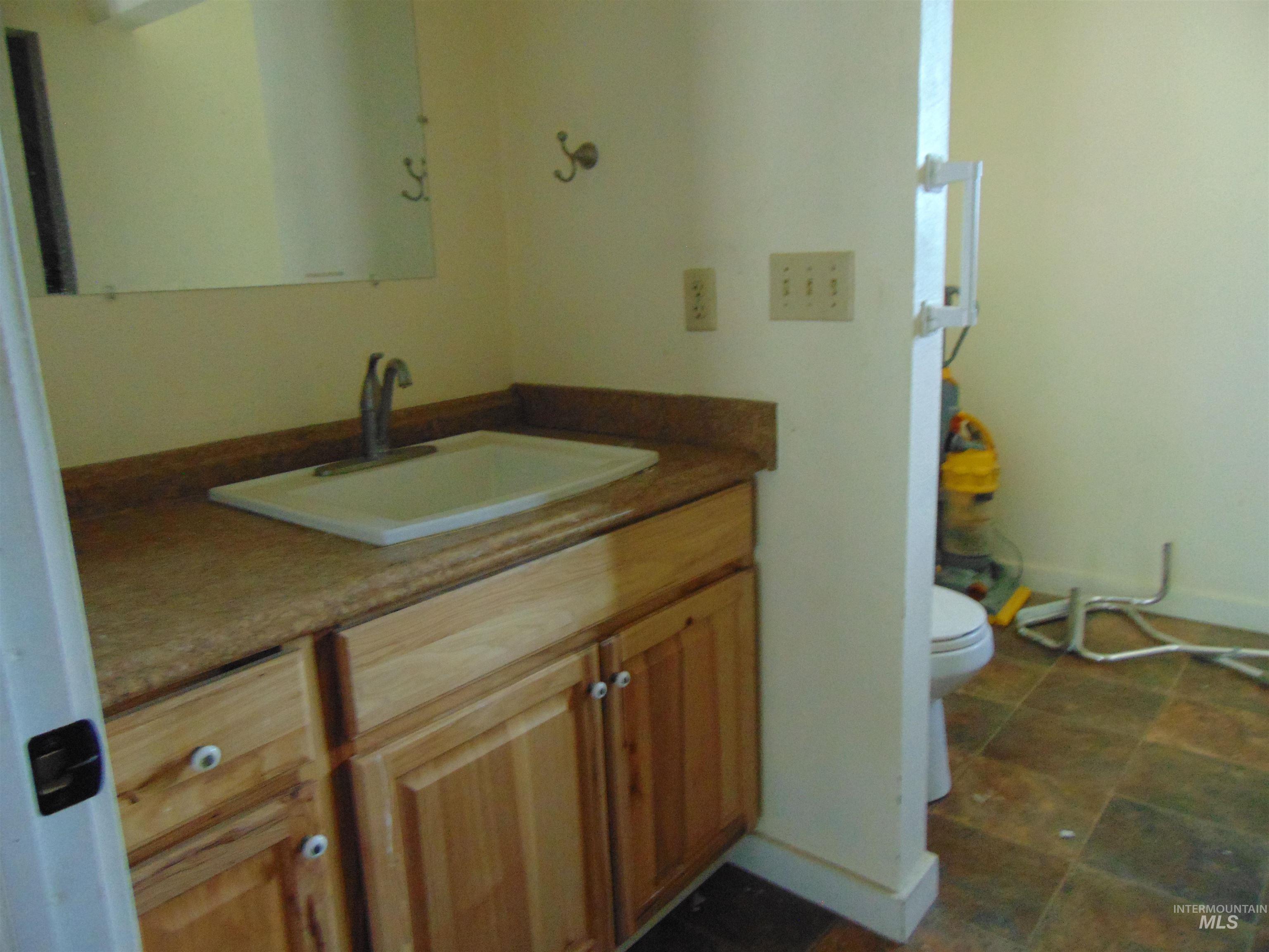 Bathroom with vanity and toilet