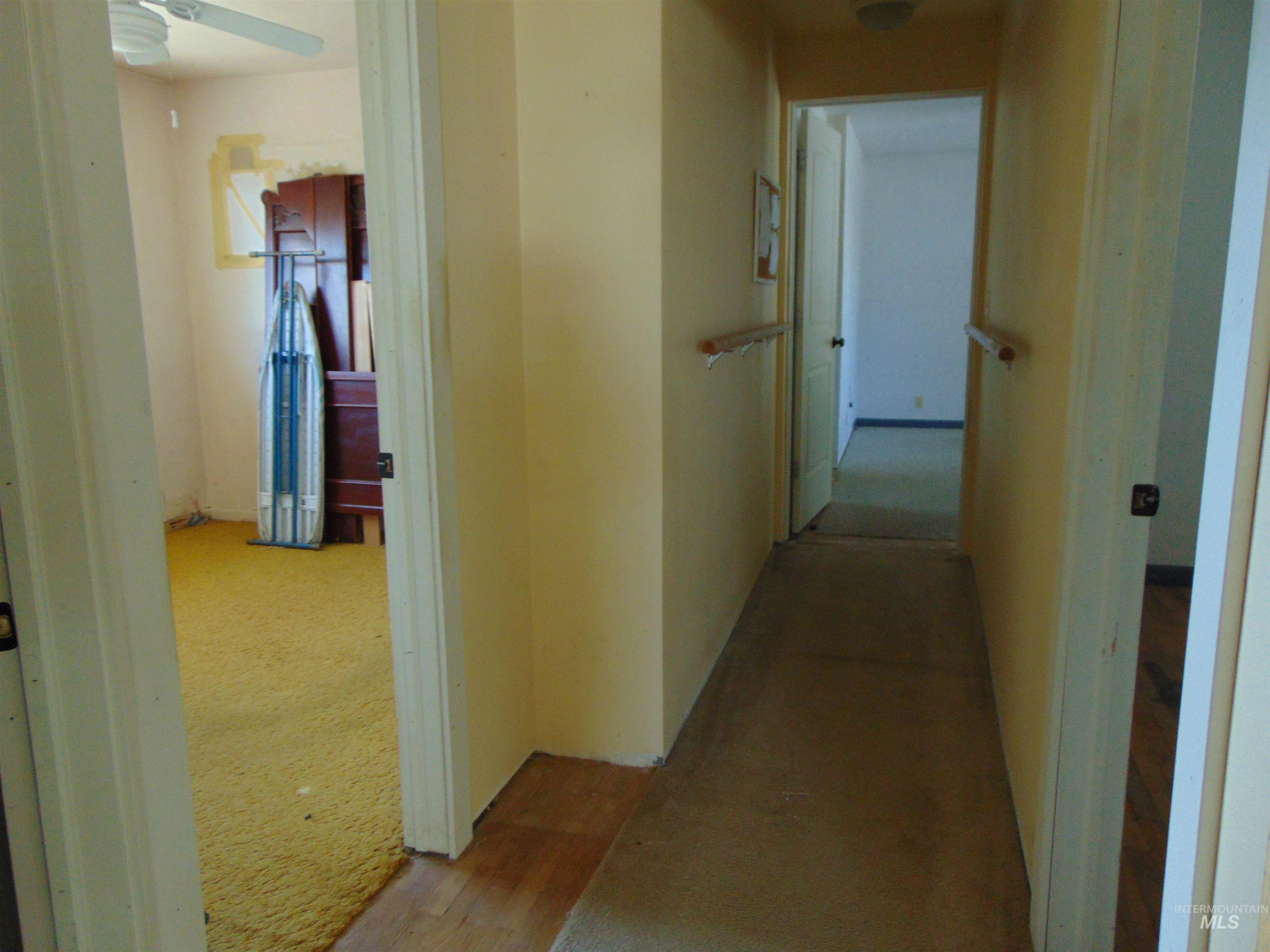 Corridor featuring carpet floors
