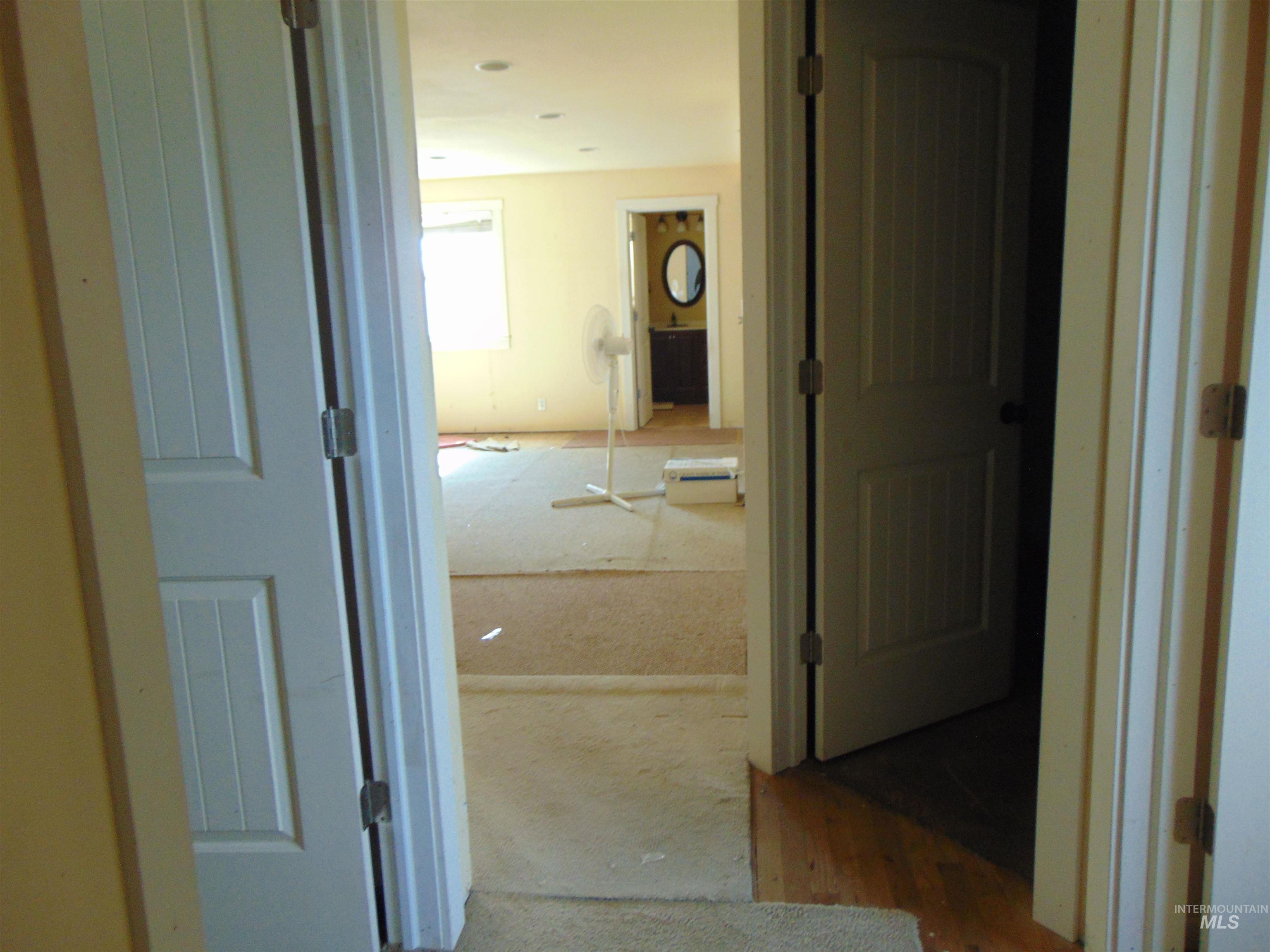 Hall featuring wood finished floors