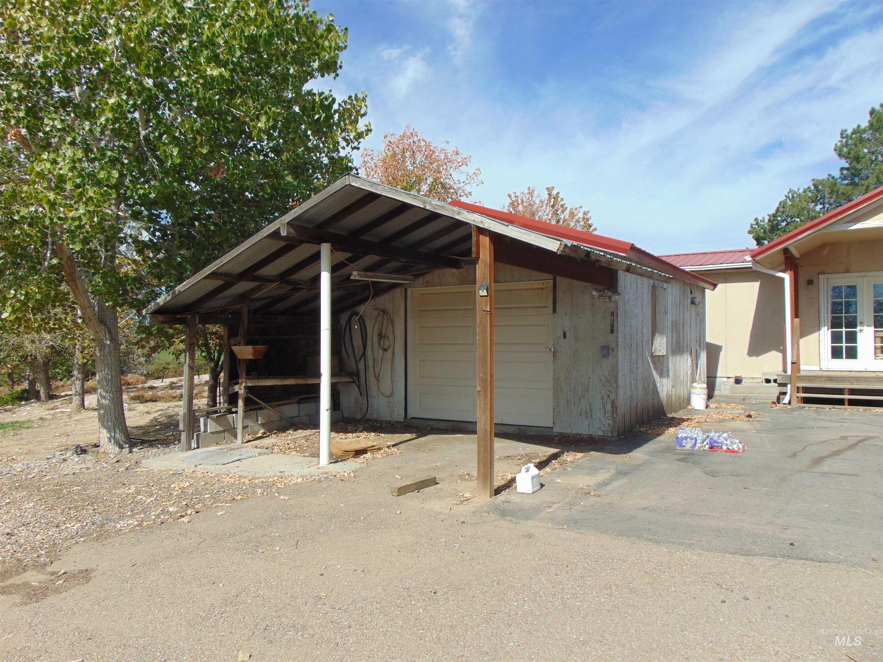 View of vehicle parking featuring a garage