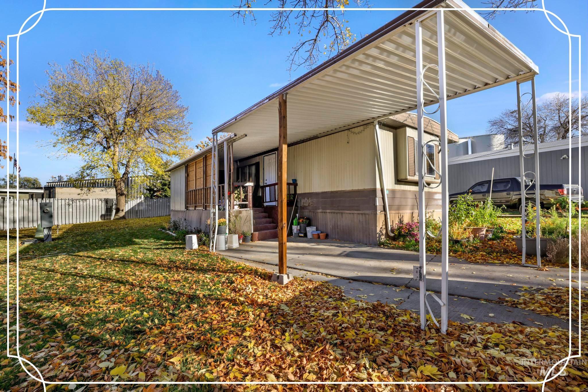 View of property exterior with a carport