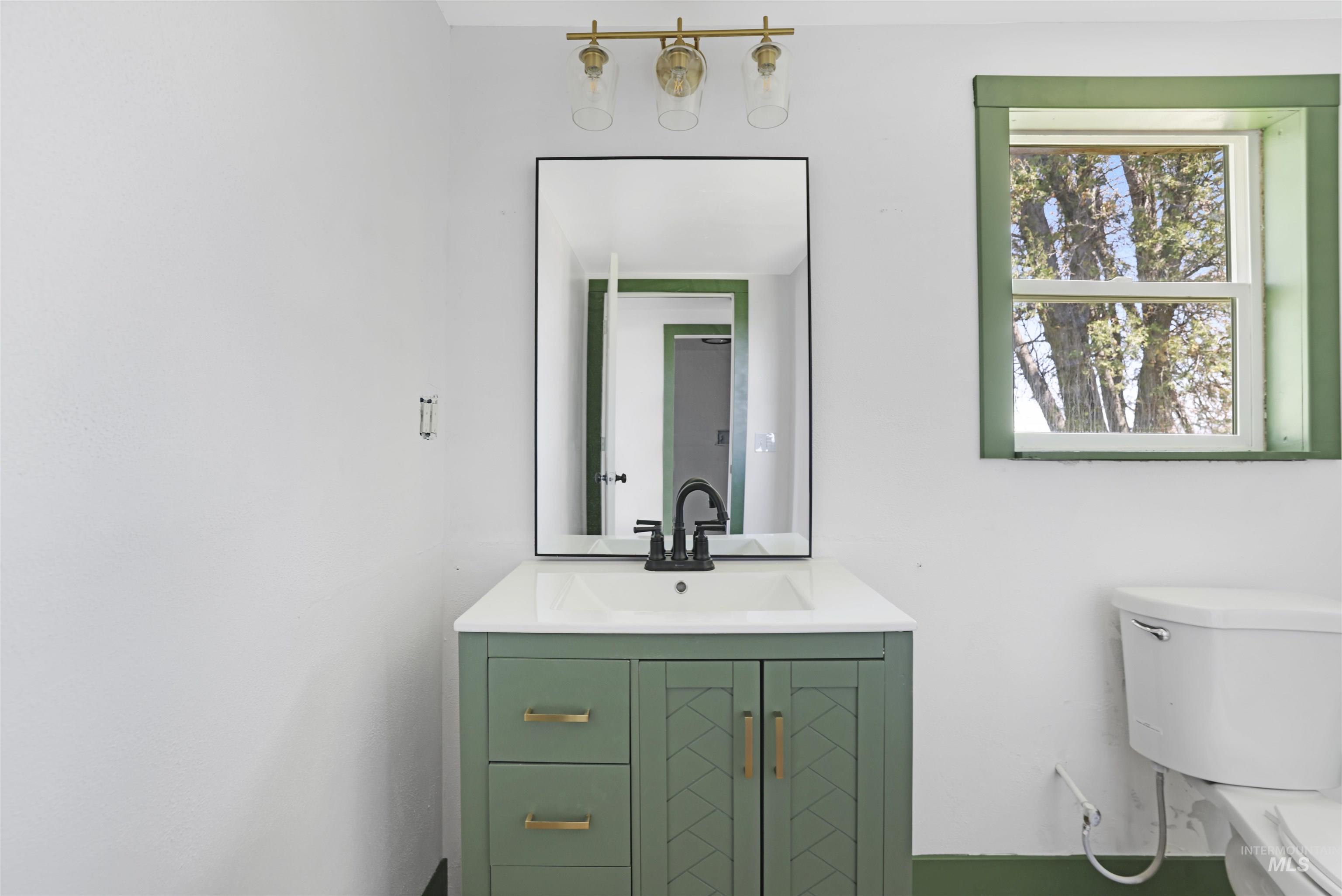 Bathroom with toilet and vanity
