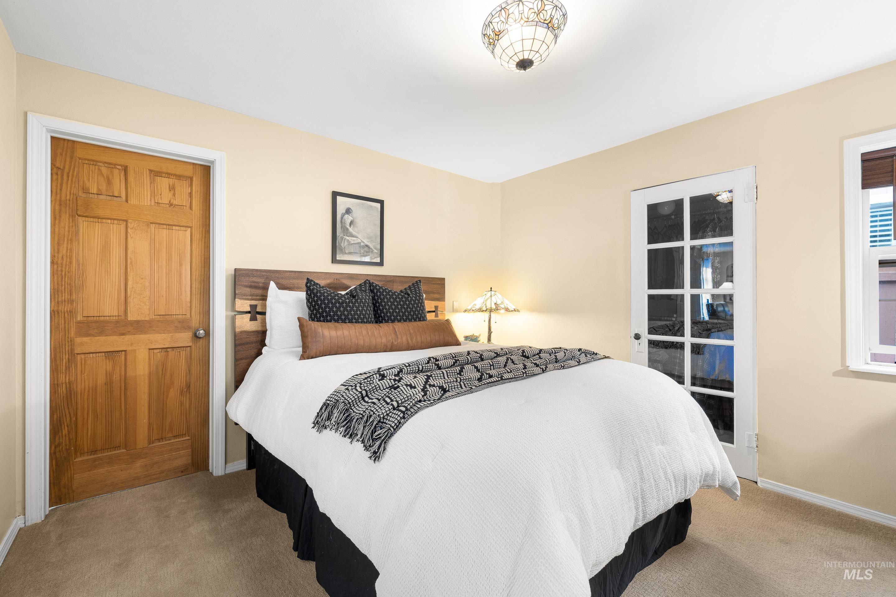 Carpeted bedroom with baseboards