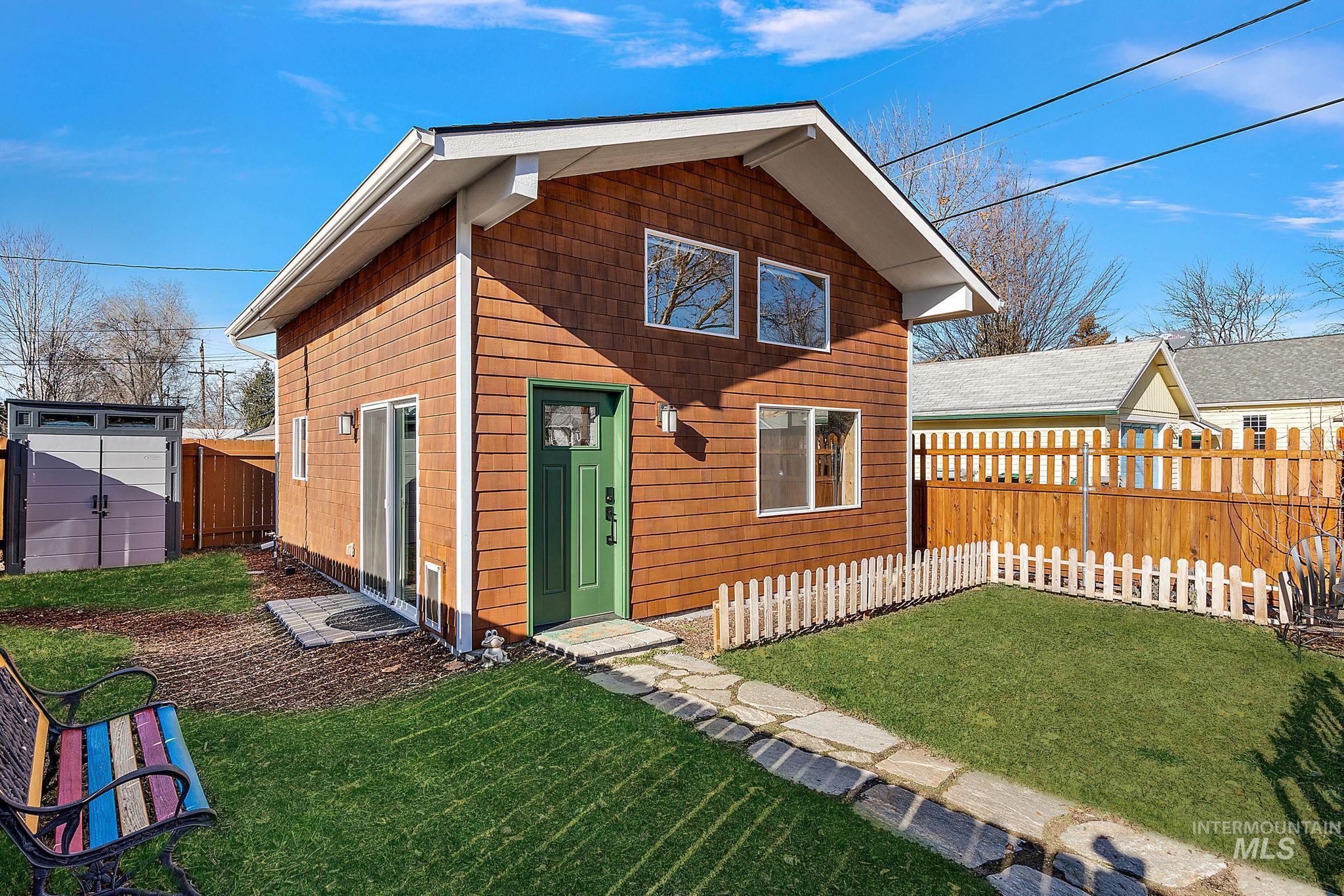 View of front of house featuring a fenced backyard
