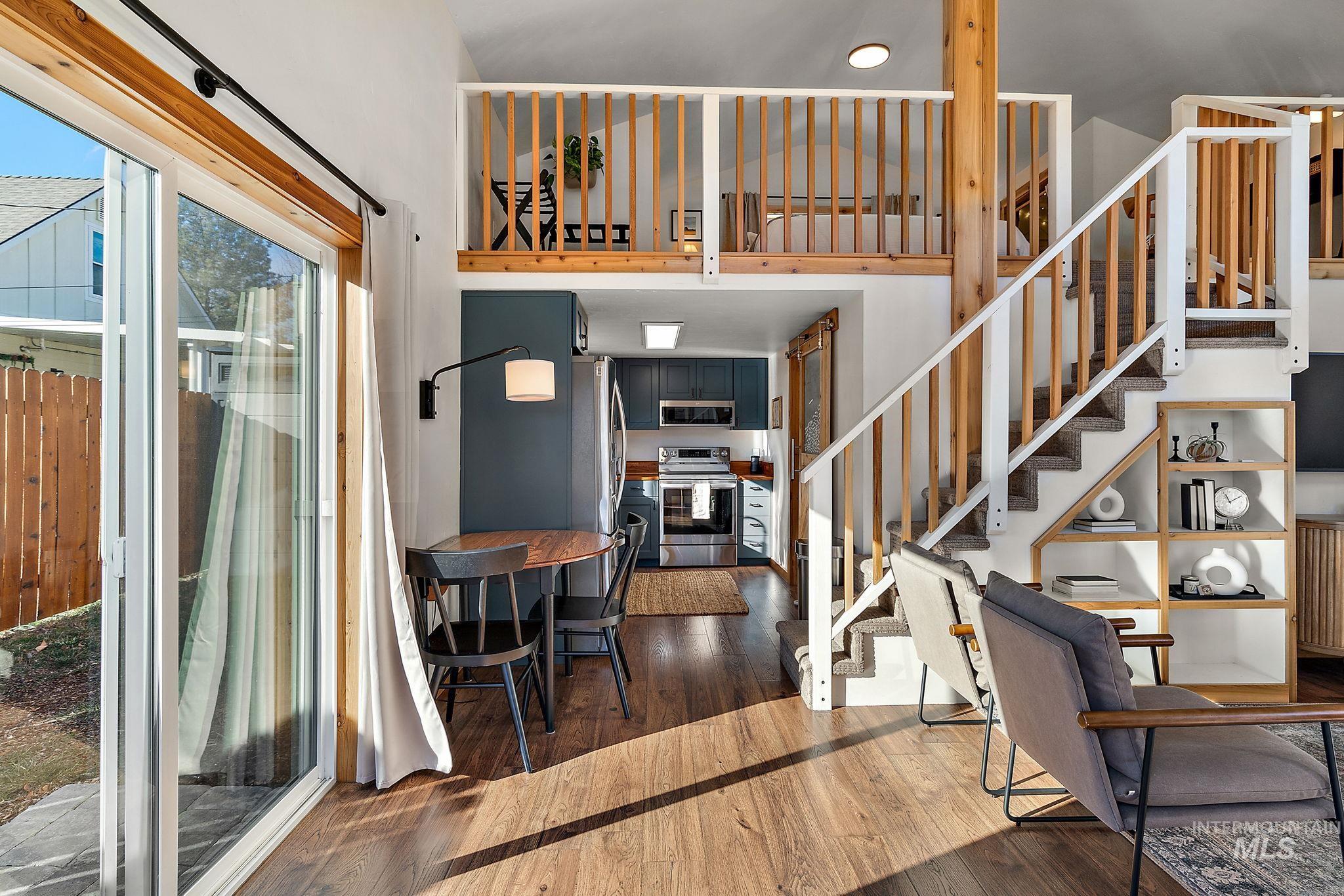 Stairway with hardwood / wood-style floors