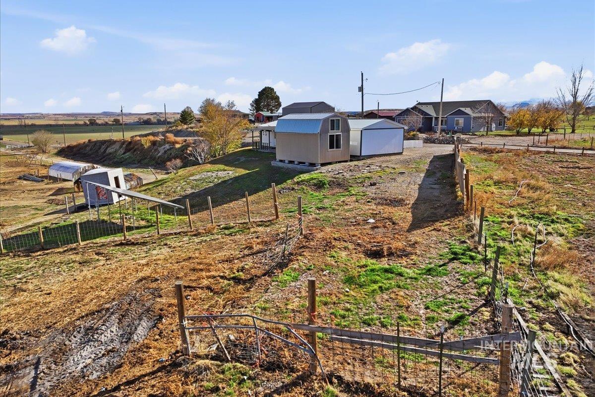 View of yard featuring an outdoor structure and a view of countryside