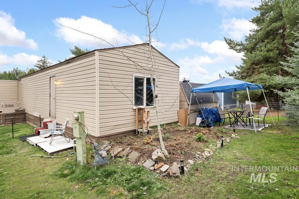 View of side of property featuring a patio area
