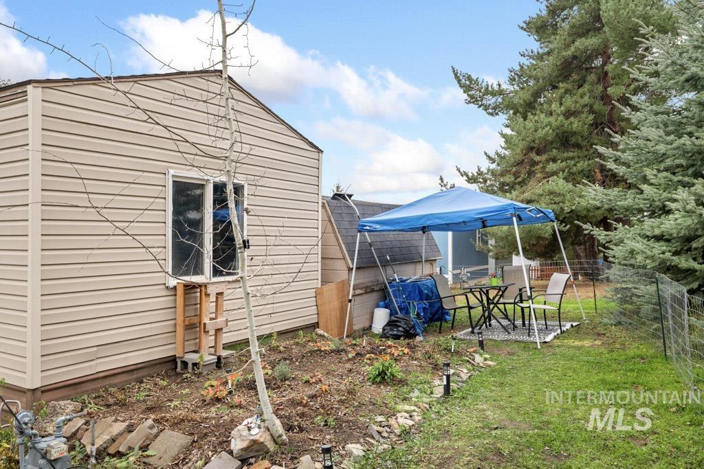 View of property exterior featuring a patio area