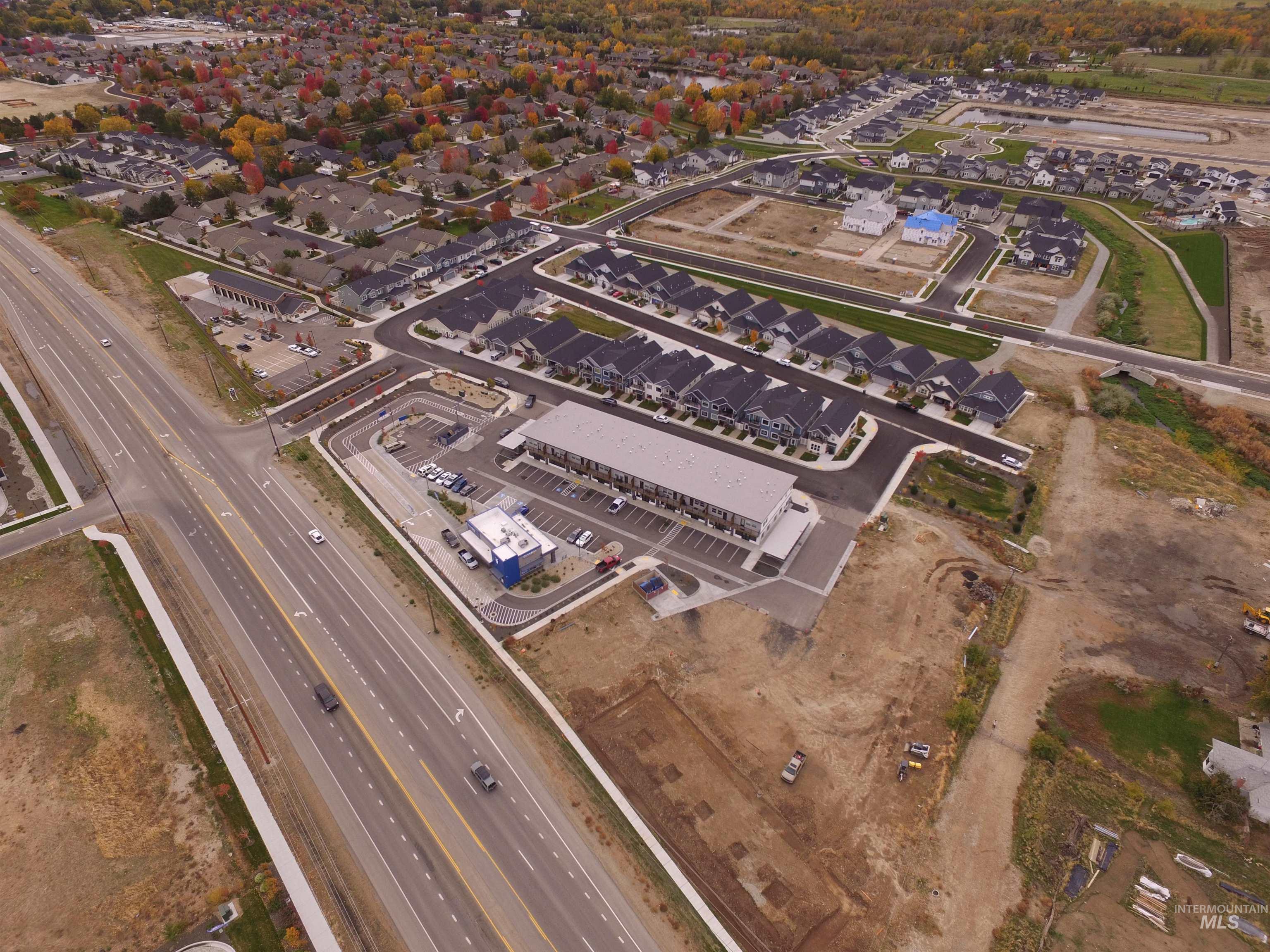 Aerial overview of property's location featuring nearby suburban area