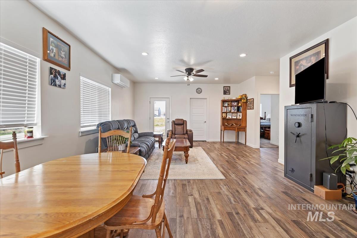 Dining area with recessed lighting, wood finished floors, and ceiling fan