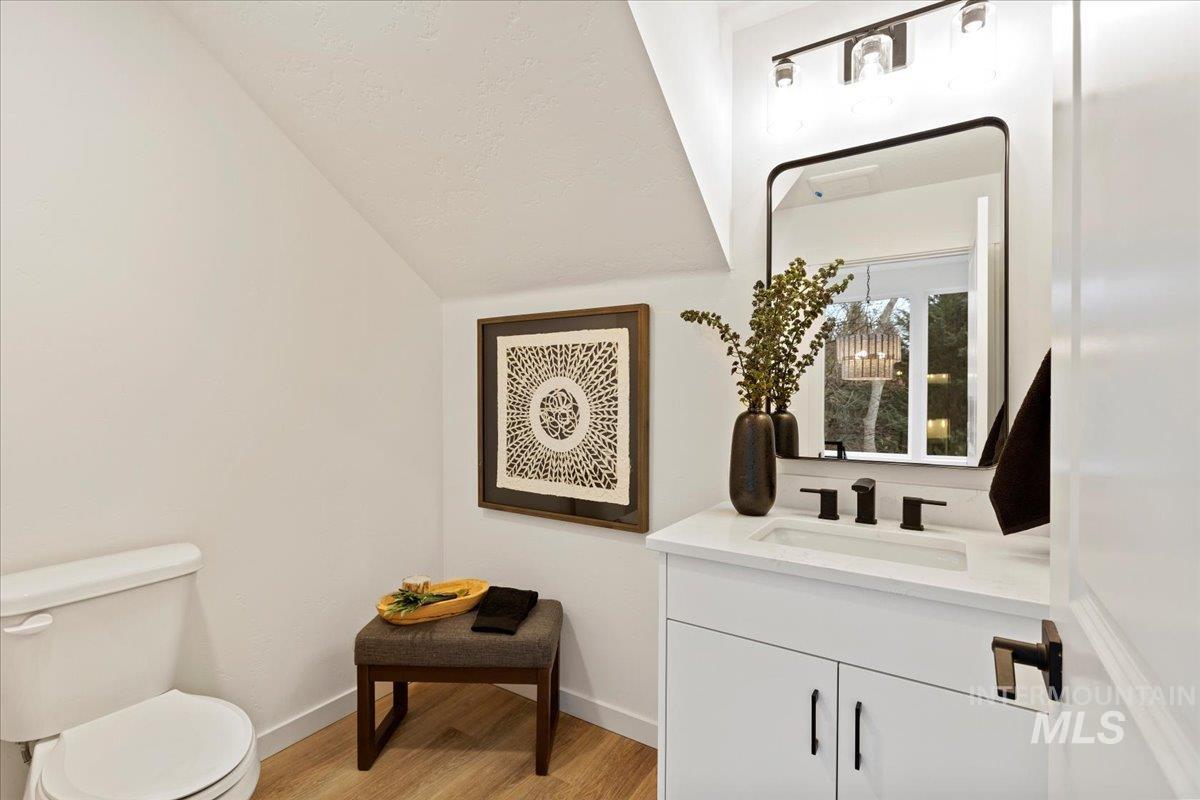 Bathroom featuring vanity and light wood-style floors