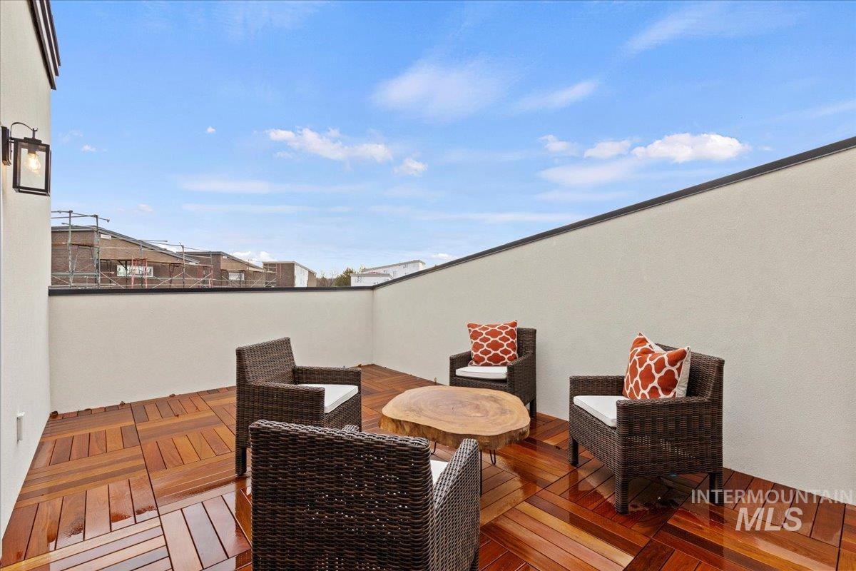 View of patio / terrace with a rooftop deck