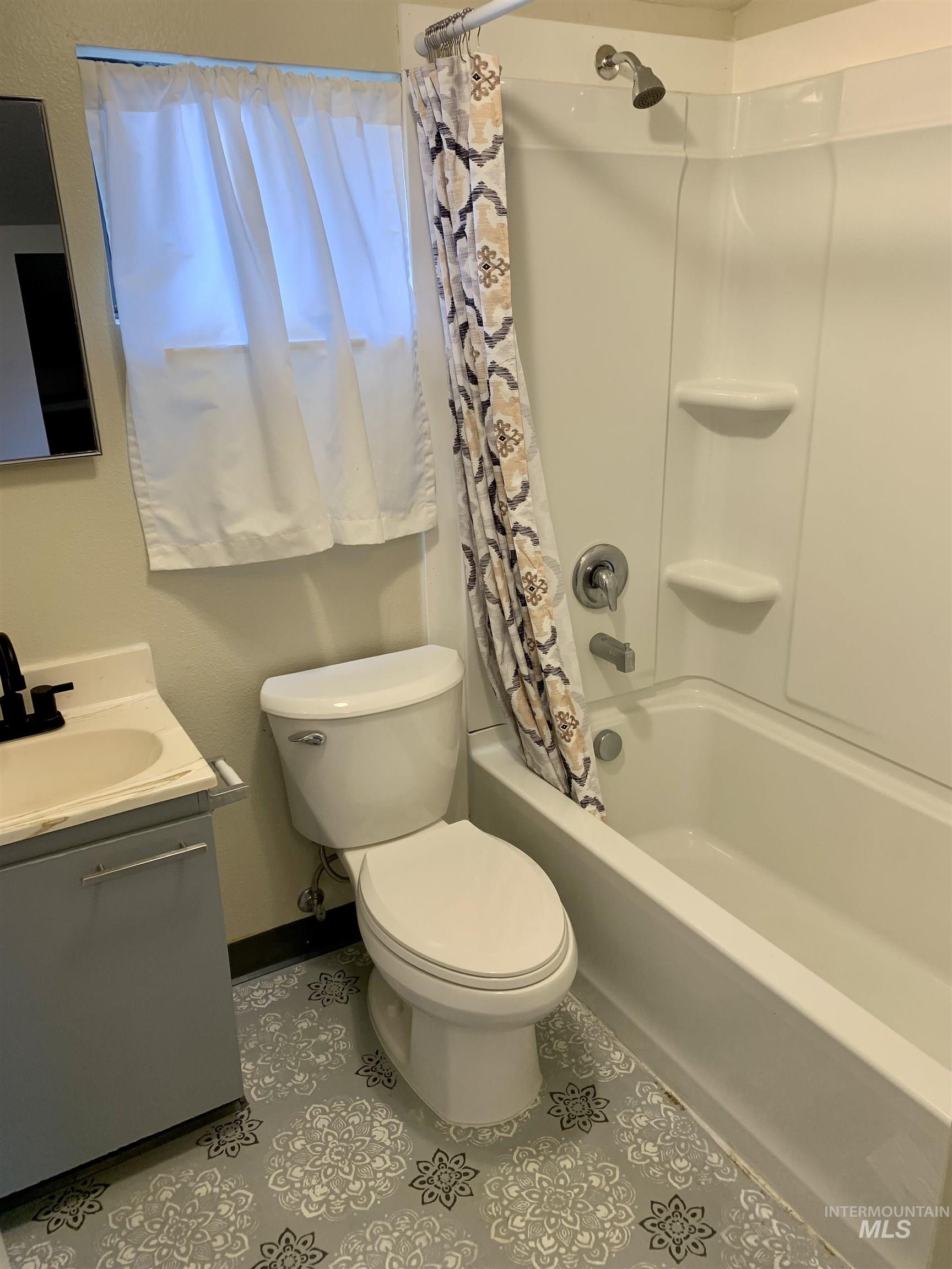 Primary bath on 2nd floor with bathroom featuring shower / bath combo and vanity.