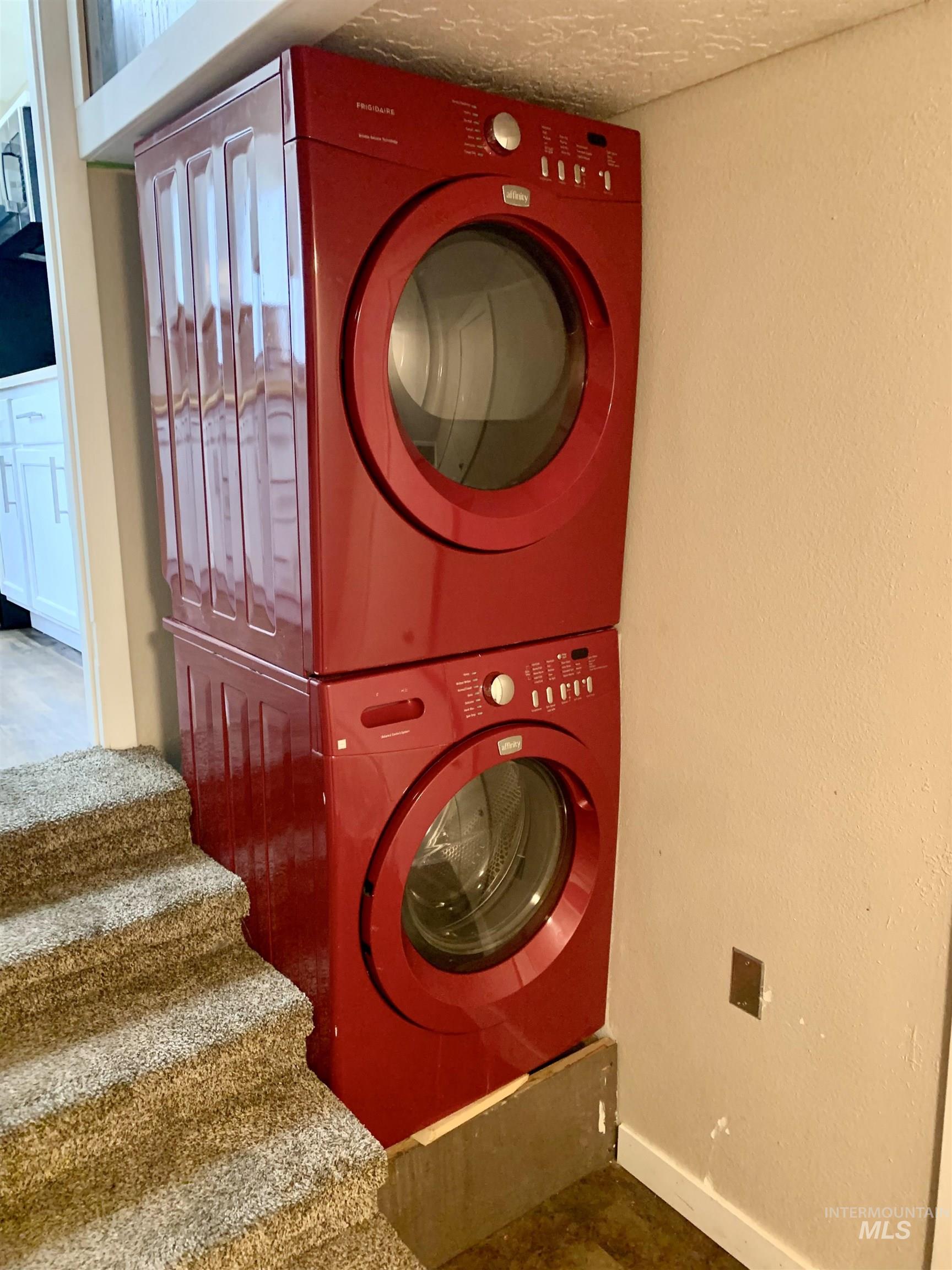 Laundry area with stacked washer / drying machine