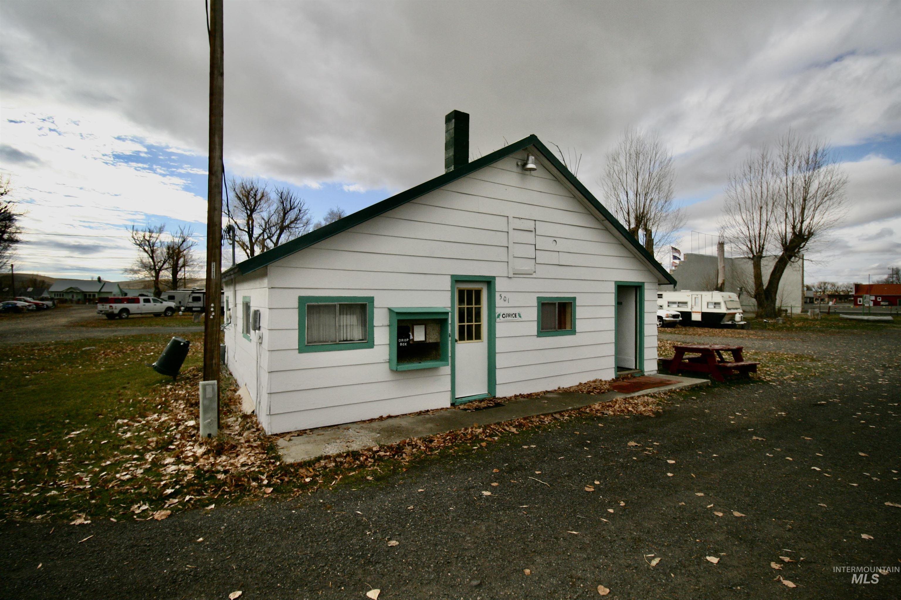 Back of property with a chimney