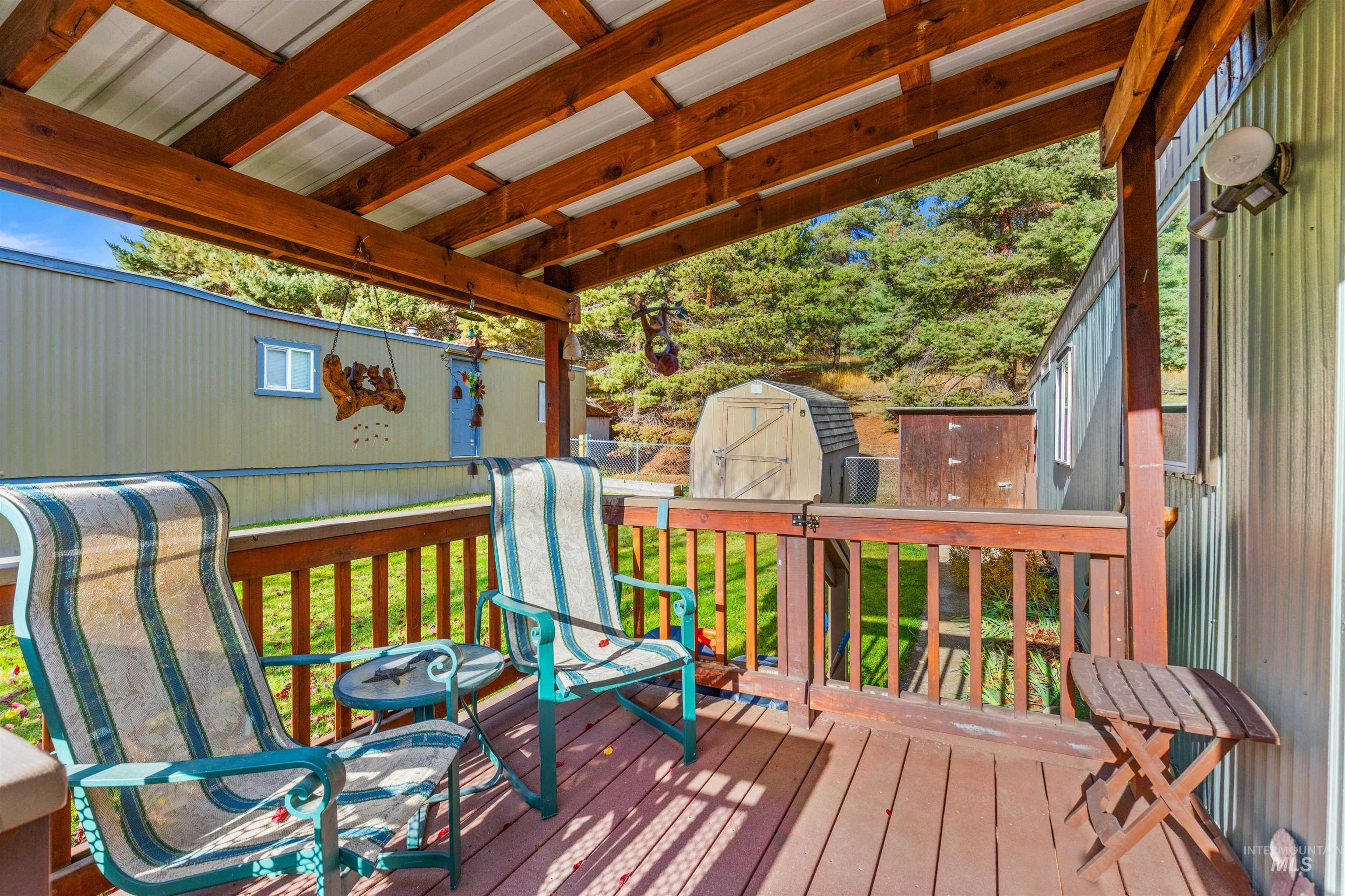 Deck with a shed and a yard