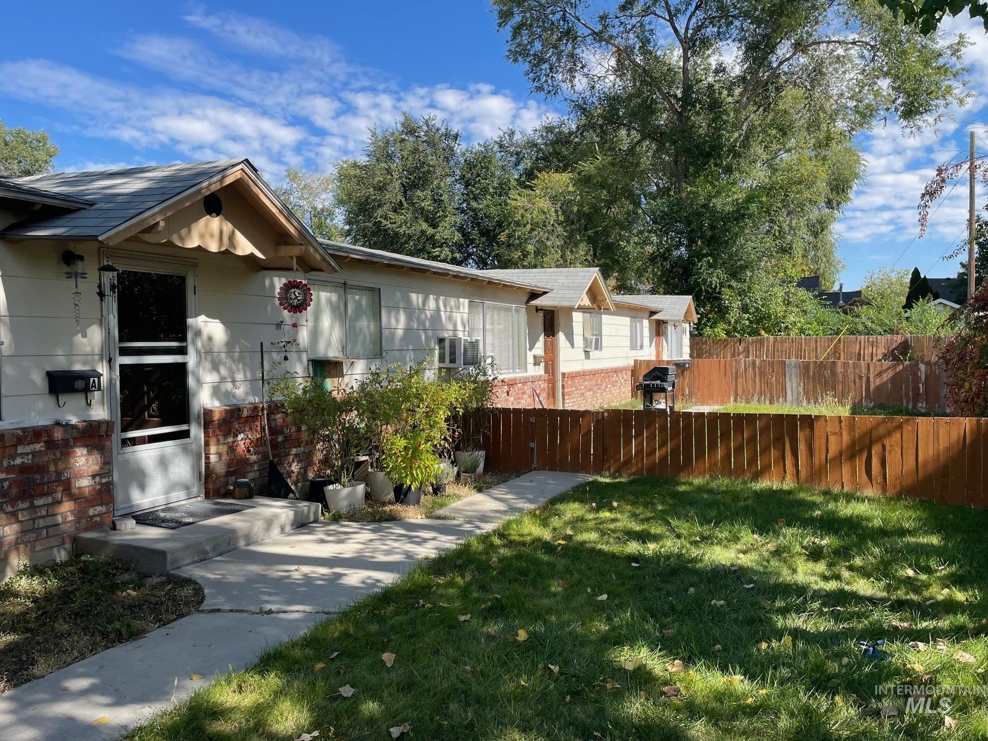 View of front of house with brick siding