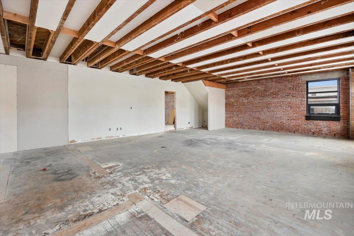 Miscellaneous room with brick wall