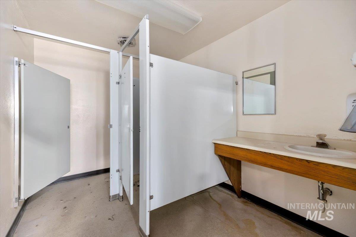 Bathroom with concrete floors and vanity