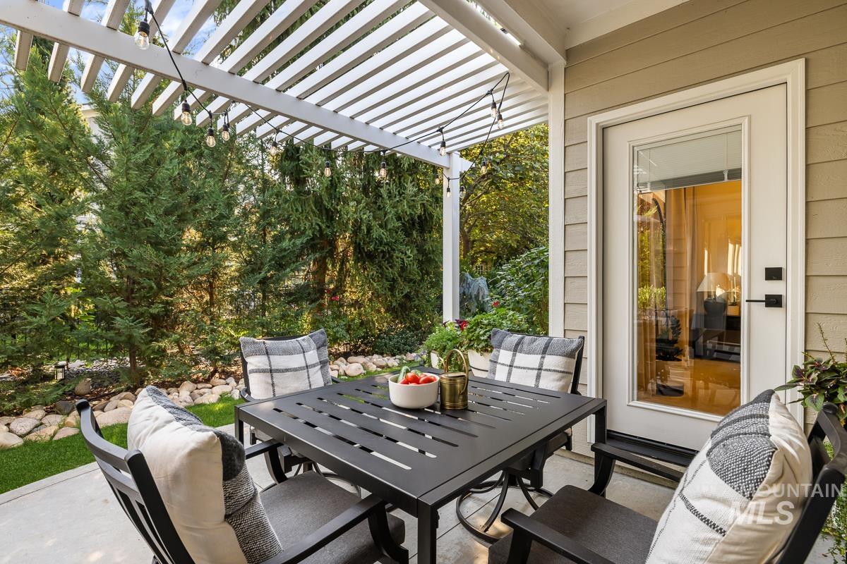 View of patio / terrace with a pergola and outdoor dining area