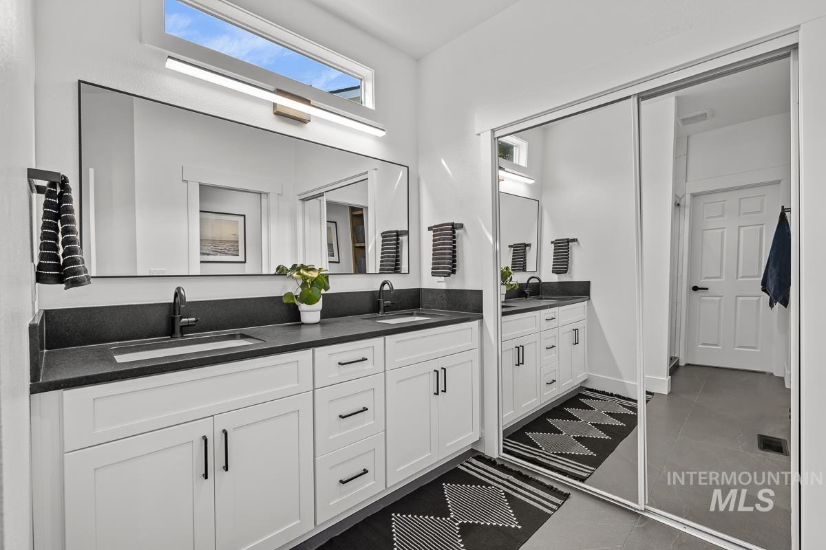 Full bathroom with double vanity