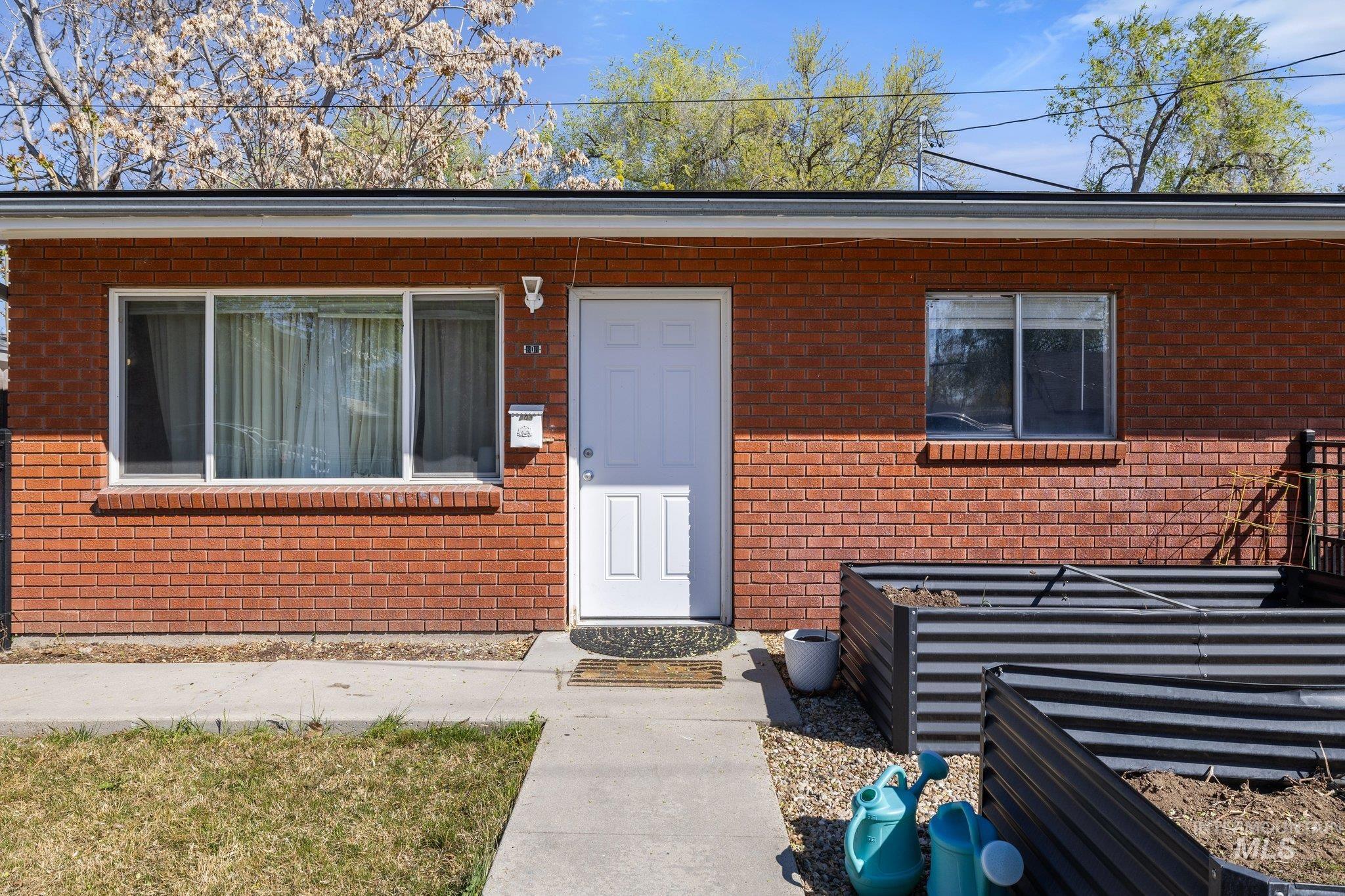 Property entrance with brick siding