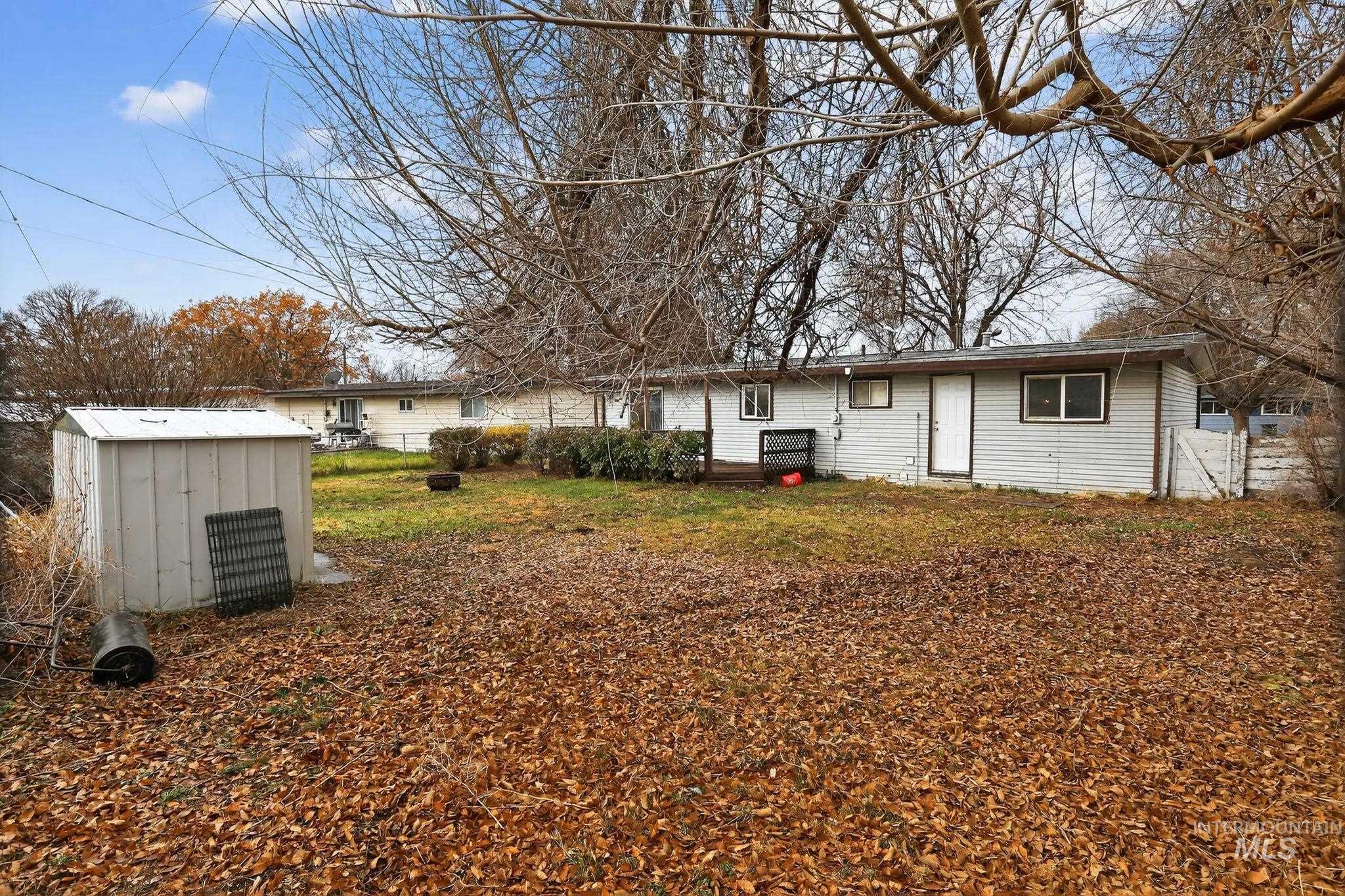 View of yard with a storage unit