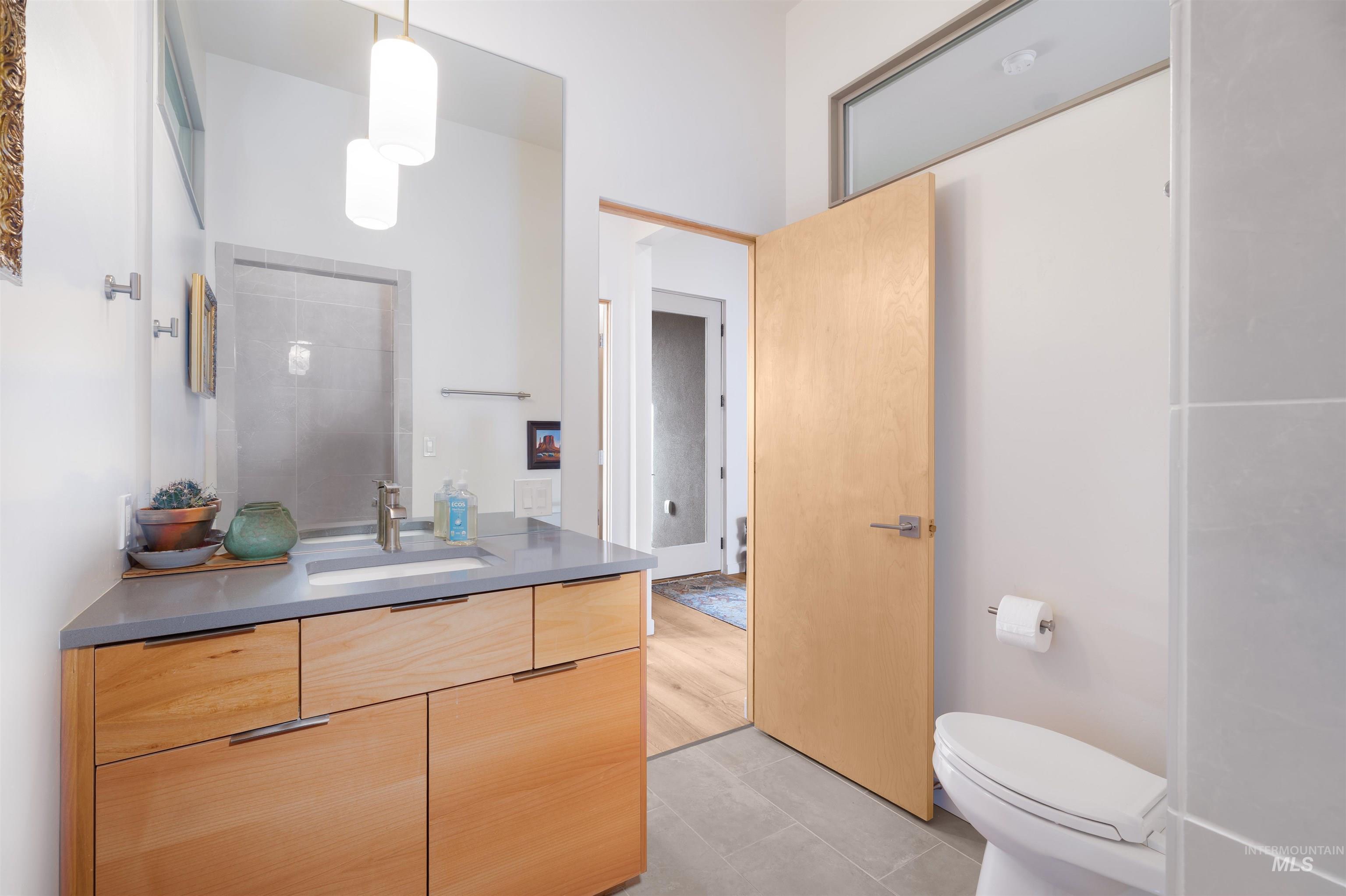 Bathroom with vanity and light tile patterned floors