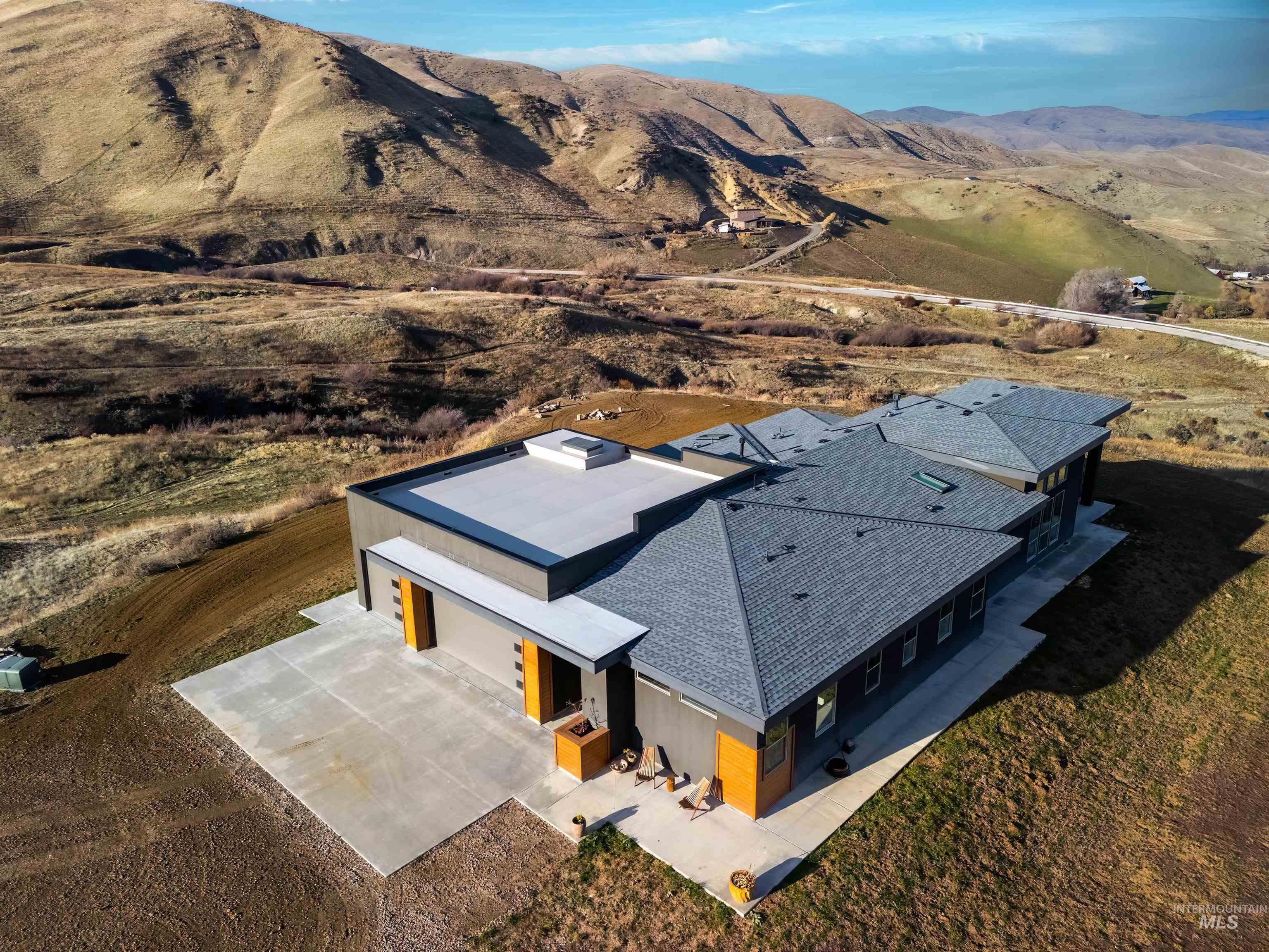 View of subject property featuring a mountainous background