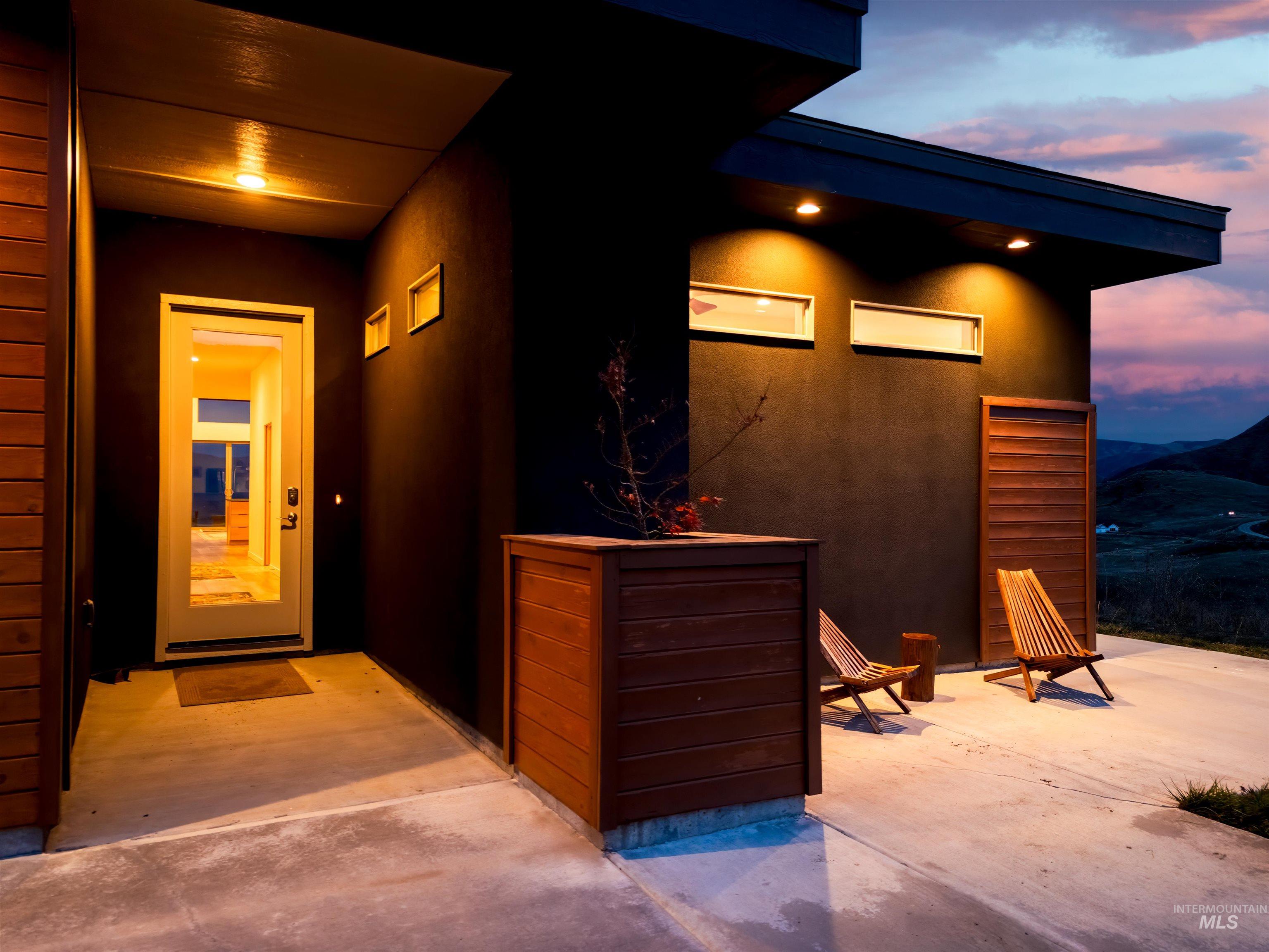 Property entrance featuring stucco siding