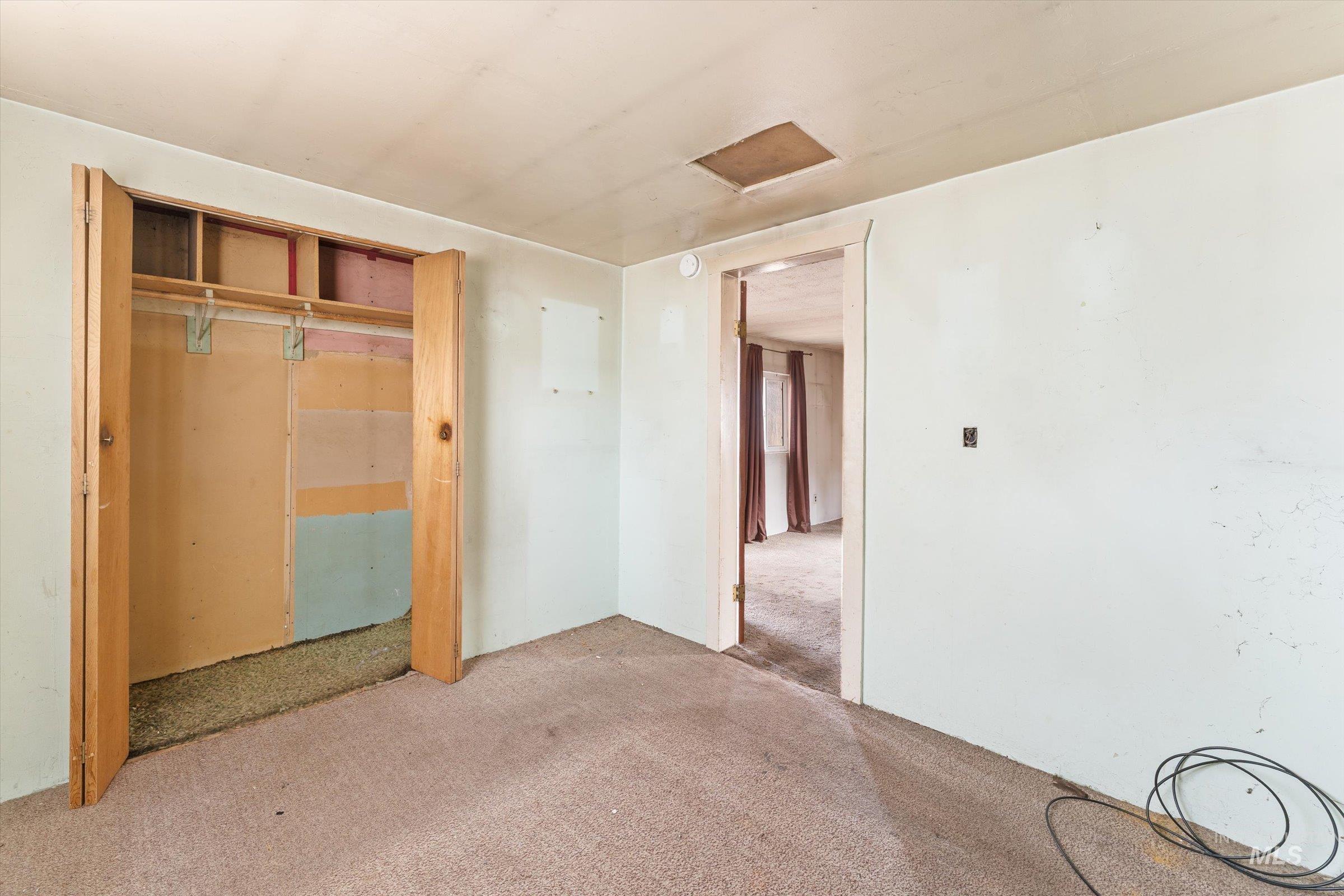 Unfurnished bedroom with carpet floors and a closet