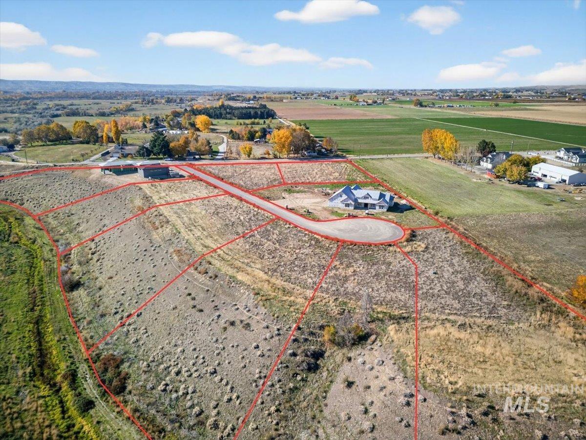 Aerial view of sparsely populated area with property boundaries highlighted